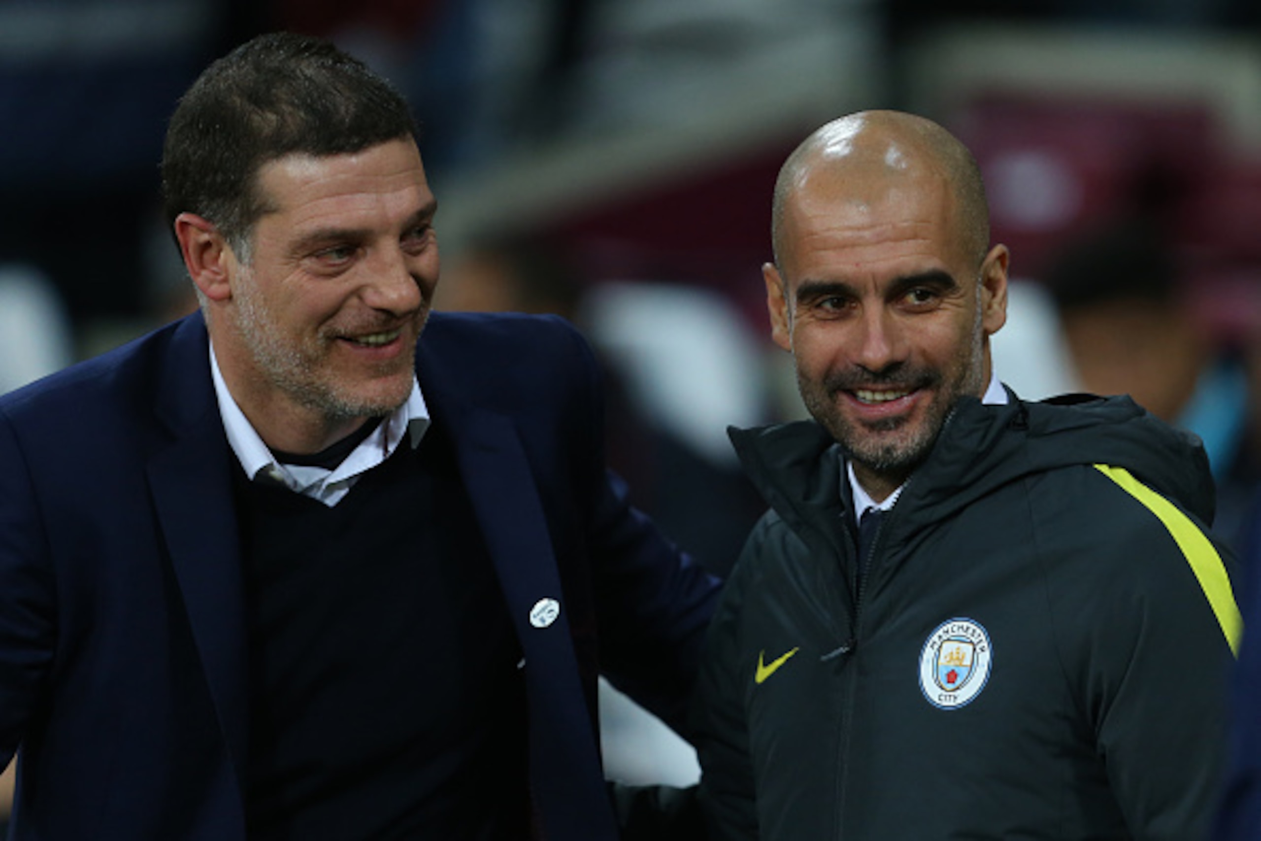 LONDON, ENGLAND - JANUARY 06: Slaven Bilic Manager / head coach of West Ham United and Pep Guardiola the head coach / manager of Manchester City during the Emirates FA Cup Third Round match between West Ham United and Manchester City at London Stadium on 