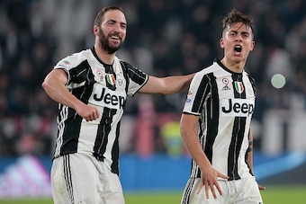 TURIN, ITALY - MARCH 10:  Paulo Dybala of Juventus FC (R) celebrates his goal with his team-mate Gonzalo Higuain during the Serie A match between Juventus FC and AC Milan at Juventus Stadium on March 10, 2017 in Turin, Italy.  (Photo by Emilio Andreoli/Ge