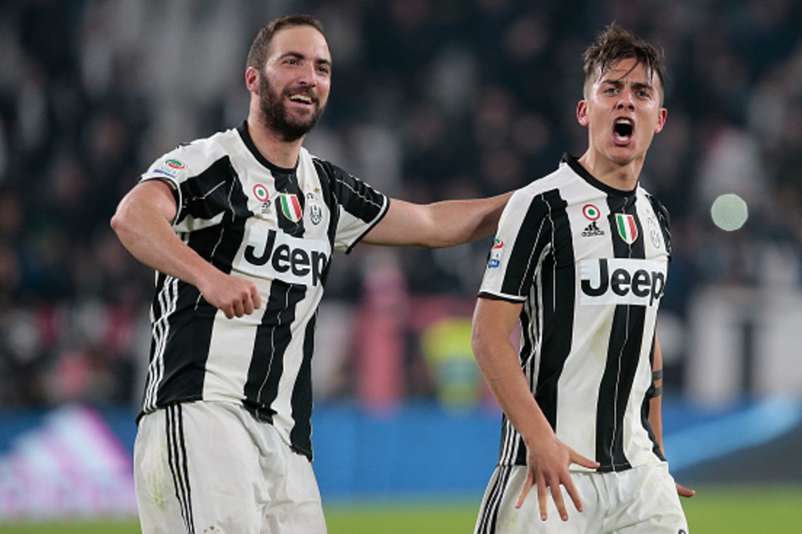 TURIN, ITALY - MARCH 10:  Paulo Dybala of Juventus FC (R) celebrates his goal with his team-mate Gonzalo Higuain during the Serie A match between Juventus FC and AC Milan at Juventus Stadium on March 10, 2017 in Turin, Italy.  (Photo by Emilio Andreoli/Ge