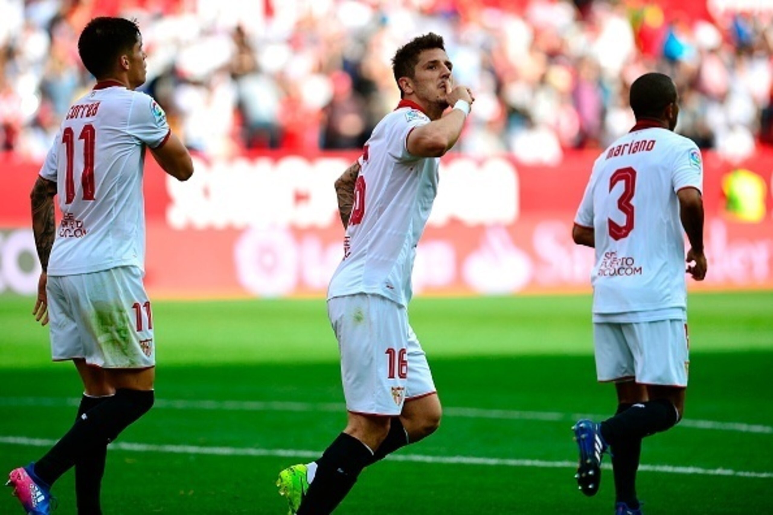 Sevilla's Montenegrin forward Stevan Jovetic (C) celebrates after scoring during the Spanish league footbal match Sevilla FC vs Club Deportivo Leganes SAD at the Ramon Sanchez Pizjuan stadium in Sevilla on March 11, 2017.
The game ended with a draw 1-1. /