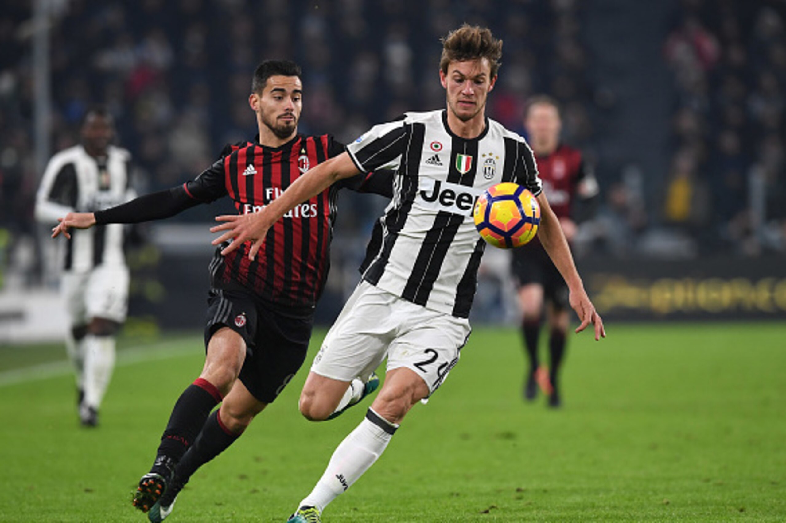 TURIN, ITALY - JANUARY 25:  Daniele Rugani (R) of Juventus FC is challenged by Fernandez Suso of AC Milan during the TIM Cup match between Juventus FC and AC Milan at Juventus Stadium on January 25, 2017 in Turin, Italy.  (Photo by Valerio Pennicino/Getty