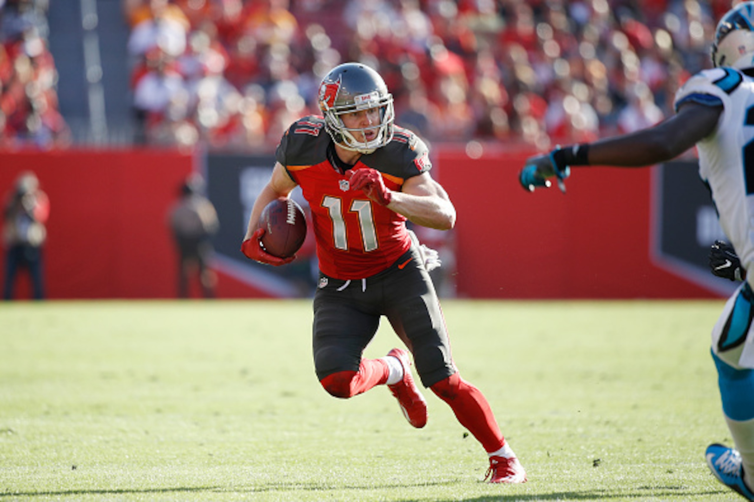 TAMPA, FL - JANUARY 01: Adam Humphries #11 of the Tampa Bay Buccaneers runs with the ball after a reception against the Carolina Panthers at Raymond James Stadium on January 1, 2017 in Tampa, Florida. The Buccaneers defeated the Panthers 17-16. (Photo by 