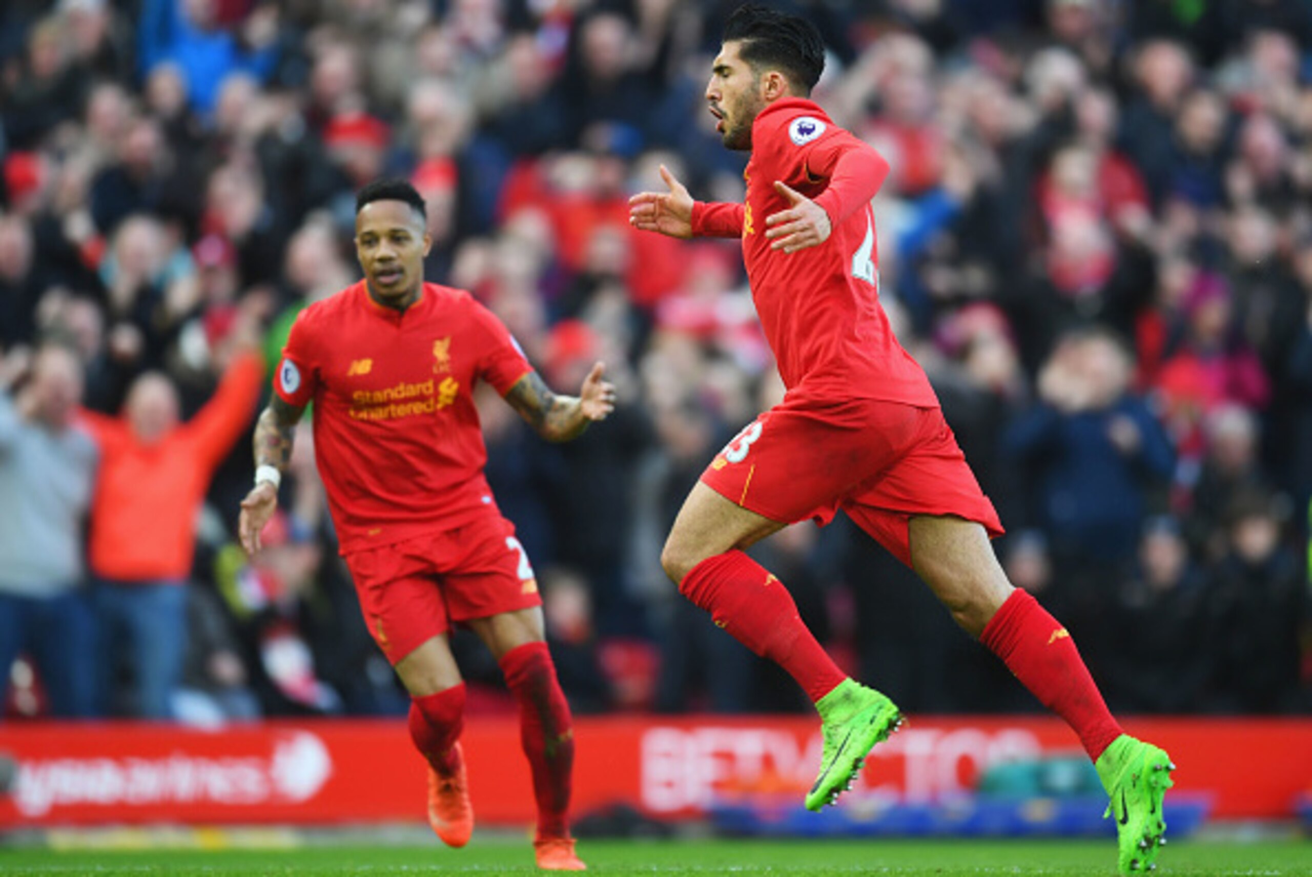 LIVERPOOL, ENGLAND - MARCH 12:  Emre Can (23) of Liverpool celebrates with Nathaniel Clyne as he as he scores their second goal during the Premier League match between Liverpool and Burnley at Anfield on March 12, 2017 in Liverpool, England.  (Photo by Mi
