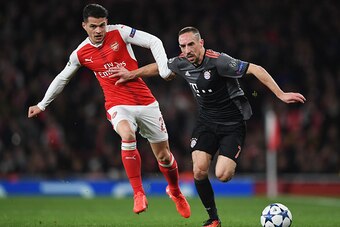 LONDON, ENGLAND - MARCH 07:  Franck Ribery of Bayern Muenchen holds off Granit Xhaka of Arsenal during the UEFA Champions League Round of 16 second leg match between Arsenal FC and FC Bayern Muenchen at Emirates Stadium on March 7, 2017 in London, United 