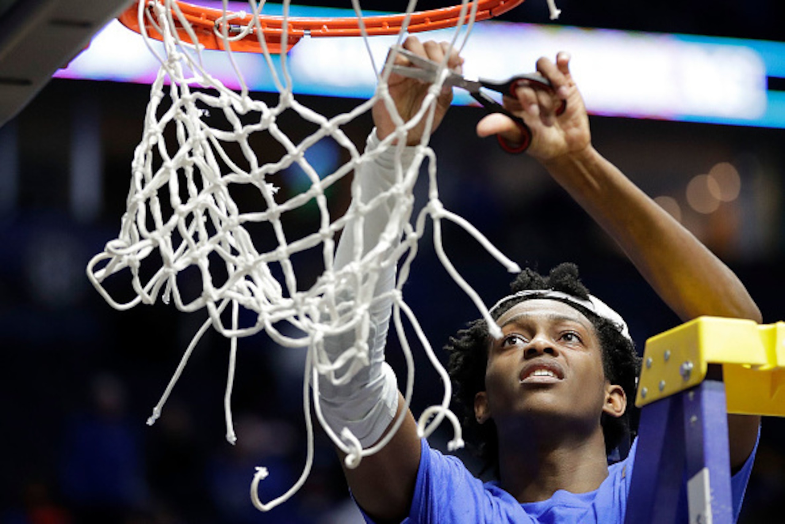 NASHVILLE, TN - MARCH 12: De'Aaron Fox #0 of the Kentucky Wildcats cuts the net after their 82-65 win over the Arkansas Razorbacks in the championship game at the 2017 Men's SEC Basketball Tournament at Bridgestone Arena on March 12, 2017 in Nashville, T NASHVILLE, TN - MARCH 12: De'Aaron Fox #0 of the Kentucky Wildcats cuts the net after their 82-65 win over the Arkansas Razorbacks in the championship game at the 2017 Men's SEC Basketball Tournament at Bridgestone Arena on March 12, 2017 in Nashville, T