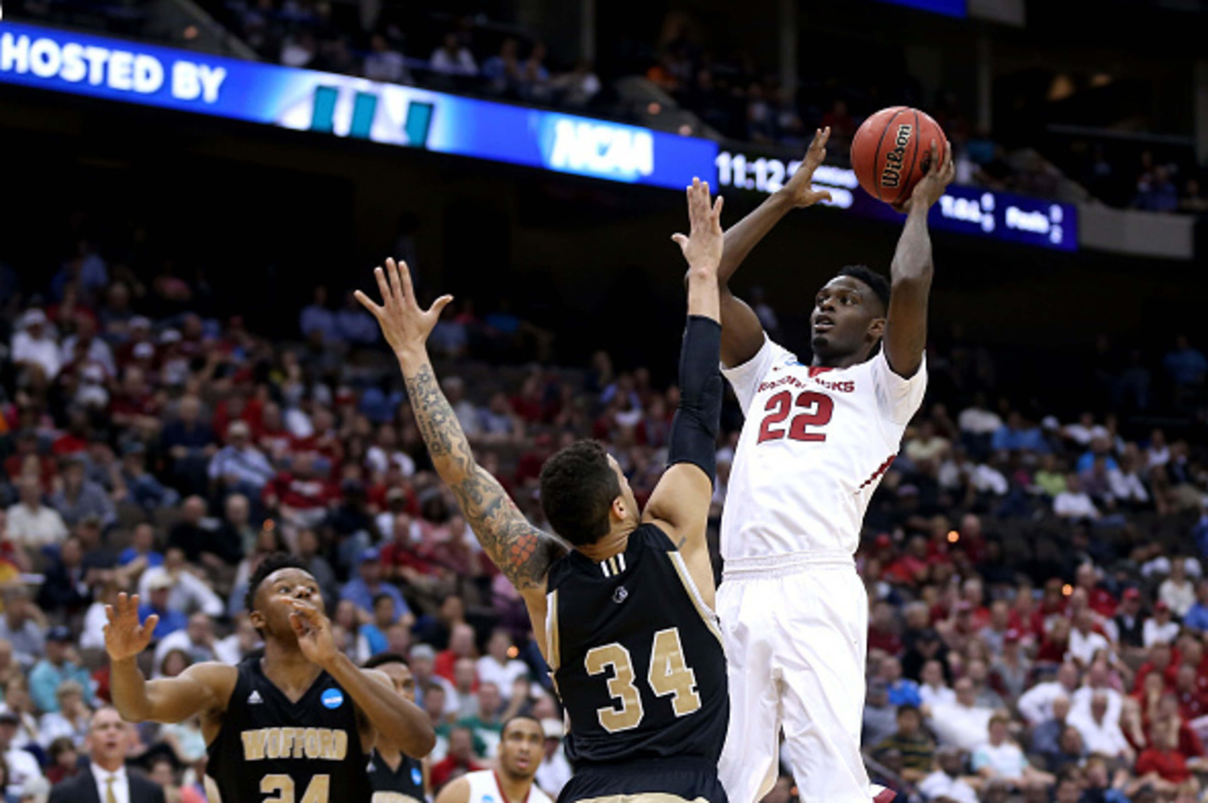 JACKSONVILLE, FL - MARCH 19: Jacorey Williams #22 of the Arkansas Razorbacks shoots over Lee Skinner #34 of the Wofford Terriers during the second round of the 2015 NCAA Men's Basketball Tournament at Jacksonville Veterans Memorial Arena on March 19, 201 JACKSONVILLE, FL - MARCH 19: Jacorey Williams #22 of the Arkansas Razorbacks shoots over Lee Skinner #34 of the Wofford Terriers during the second round of the 2015 NCAA Men's Basketball Tournament at Jacksonville Veterans Memorial Arena on March 19, 201