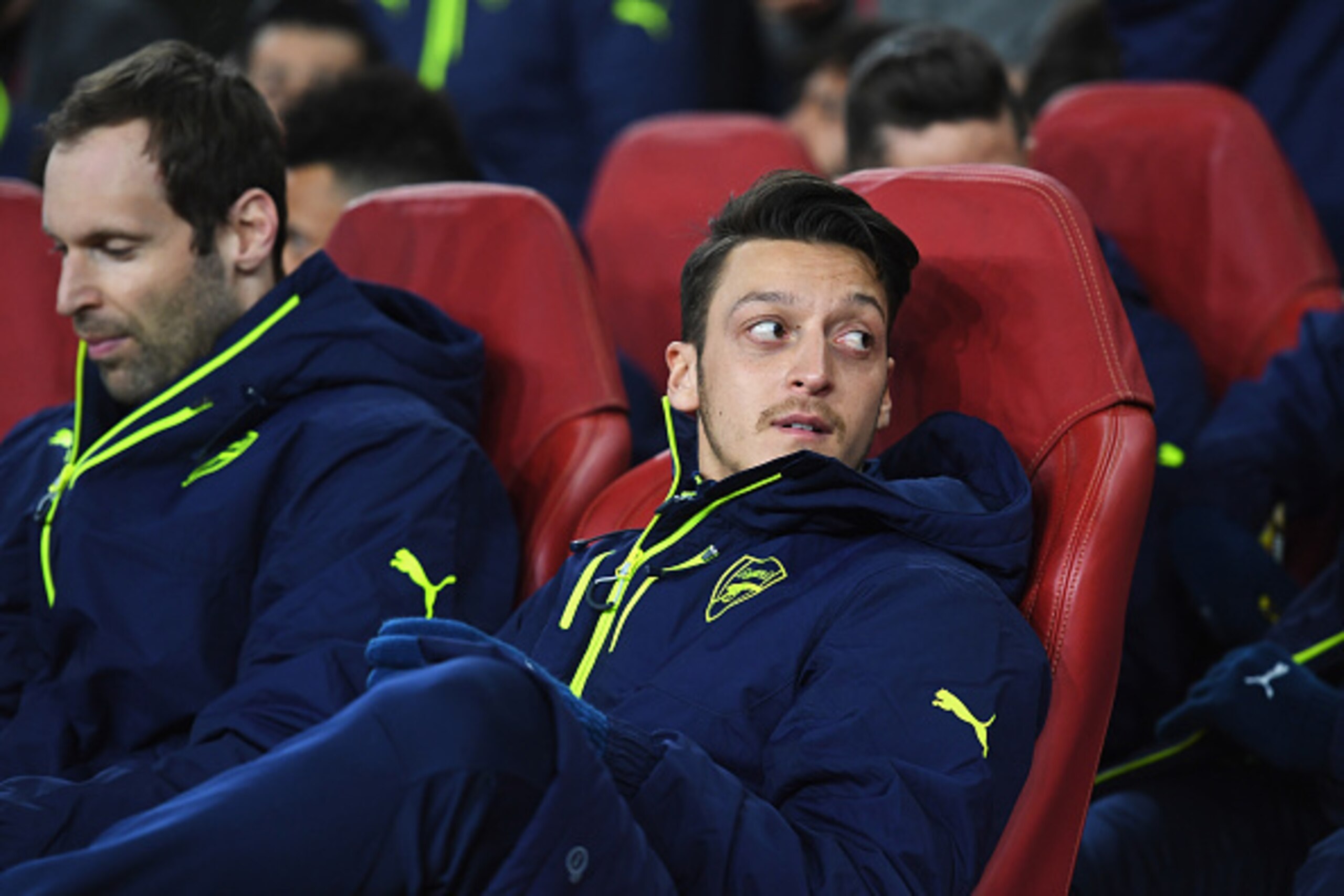 LONDON, ENGLAND - MARCH 07:  Mesut Oezil of Arsenal looks on from the bench prior to the UEFA Champions League Round of 16 second leg match between Arsenal FC and FC Bayern Muenchen at Emirates Stadium on March 7, 2017 in London, United Kingdom.  (Photo b