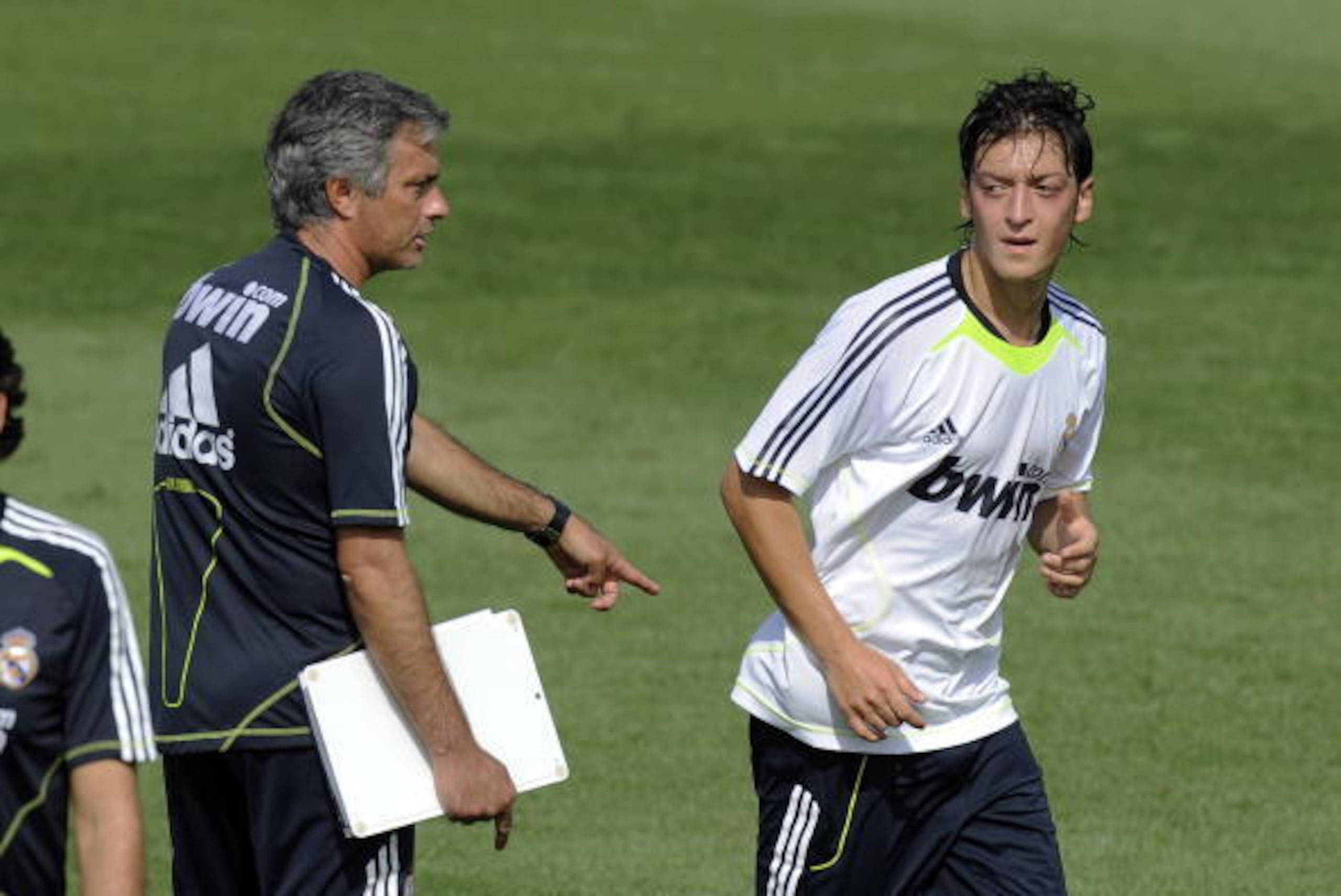 Real Madrid's new German player Mesut Ozil (R) and coach Jose Mourinho attend a training session at the Real Madrid Sports City in Madrid on August 19, 2010. The German football star Ozil has quit the Bundesliga and Werder Bremen to sign a contract with S