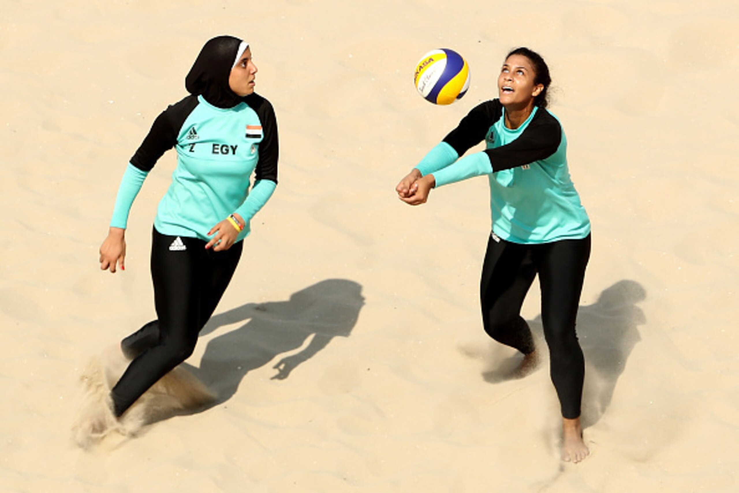 RIO DE JANEIRO, BRAZIL - AUGUST 09: Doaa Elghobashy (L) and Nada Meawad of Egypt in action during the Women's Beach Volleyball Preliminary Pool A match against Marta Menegatti and Laura Giombini of Italy on Day 4 of the Rio 2016 Olympic Games at the Beach RIO DE JANEIRO, BRAZIL - AUGUST 09: Doaa Elghobashy (L) and Nada Meawad of Egypt in action during the Women's Beach Volleyball Preliminary Pool A match against Marta Menegatti and Laura Giombini of Italy on Day 4 of the Rio 2016 Olympic Games at the Beach