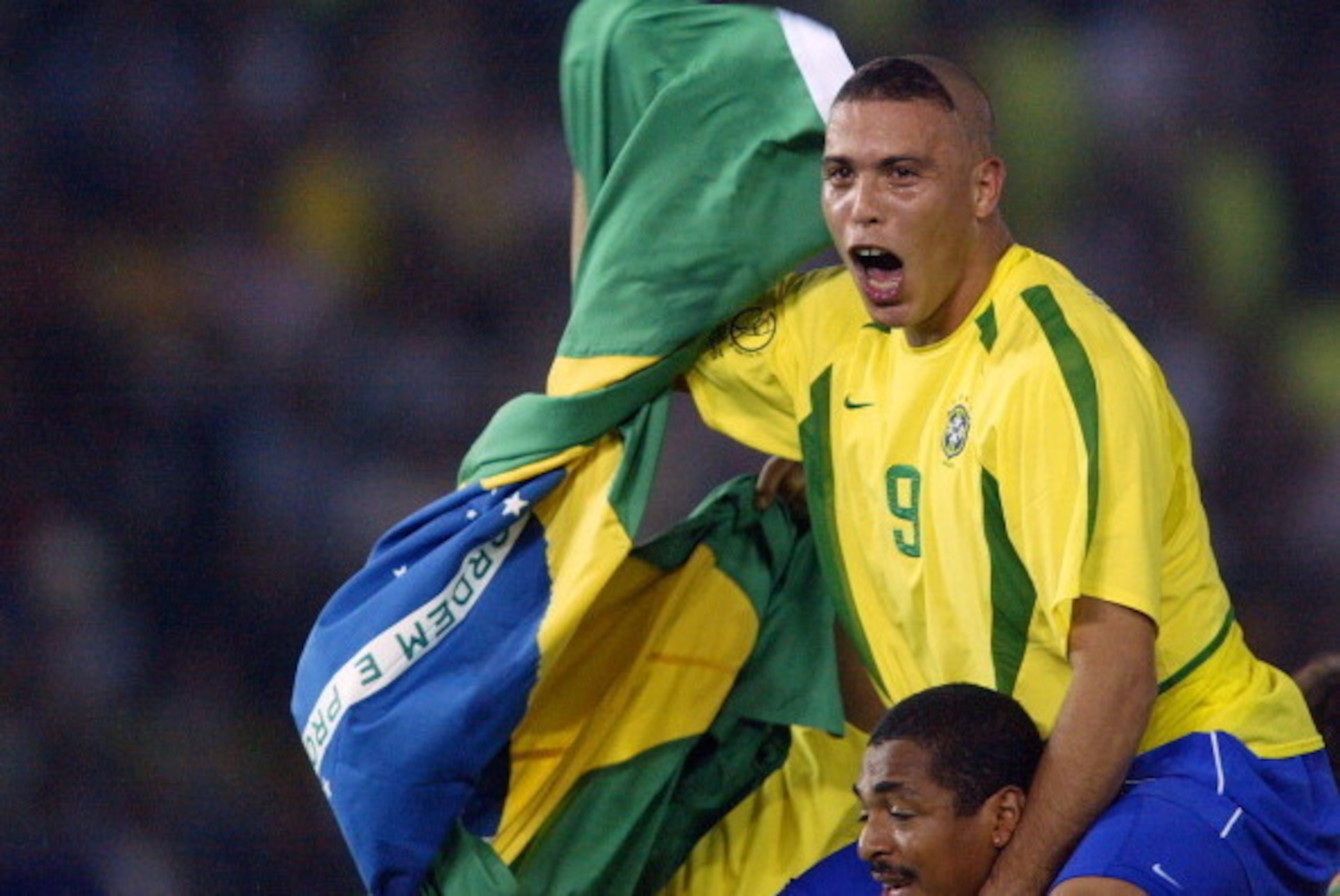 Brazil's forward Ronaldo celebrates, with tears in his eyes, after Brazil won 2-0 against Germany in match 64 of the 2002 FIFA World Cup Korea Japan final 30 June, 2002 at the International Stadium Yokohama, Japan. Ronaldo scored the two winning goals, gi