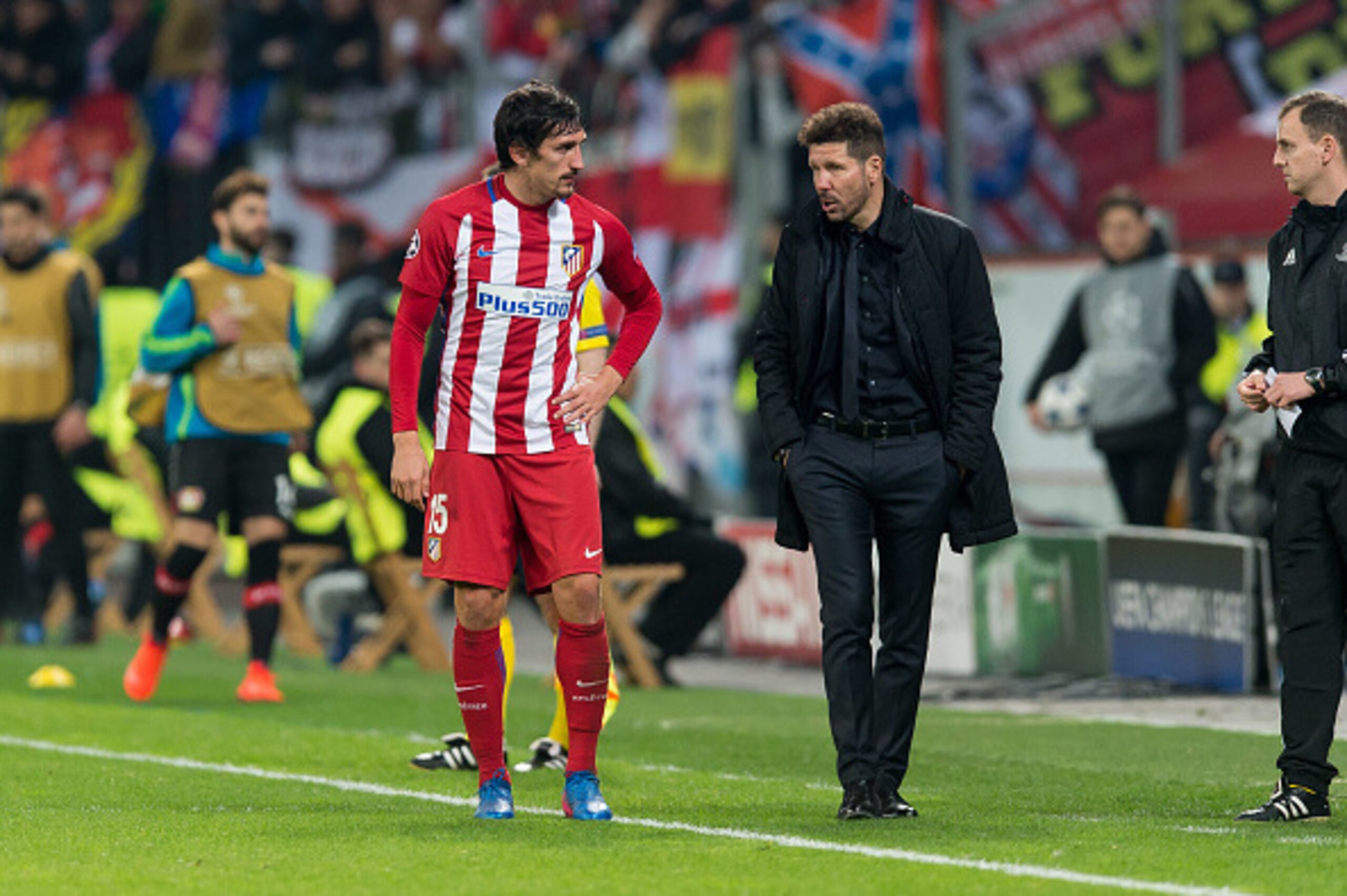 LEVERKUSEN, GERMANY - FEBRUARY 21: Stefan Savic of Atletico Madrid speak with Head coach Diego Simeone of Atletico Madrid during the UEFA Champions League Round of 16 first leg match between Bayer Leverkusen and Club Atletico de Madrid at BayArena on Febr