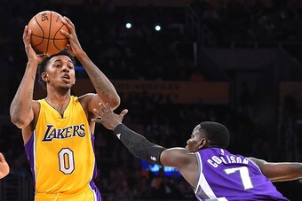 LOS ANGELES, CA - FEBRUARY 14:  Darren Collison #7 of the Sacramento Kings guards Nick Young #0 of the Los Angeles Lakers as Collson looks to pass in the first half of the game at Staples Center on February 14, 2017 in Los Angeles, California. NOTE TO USE