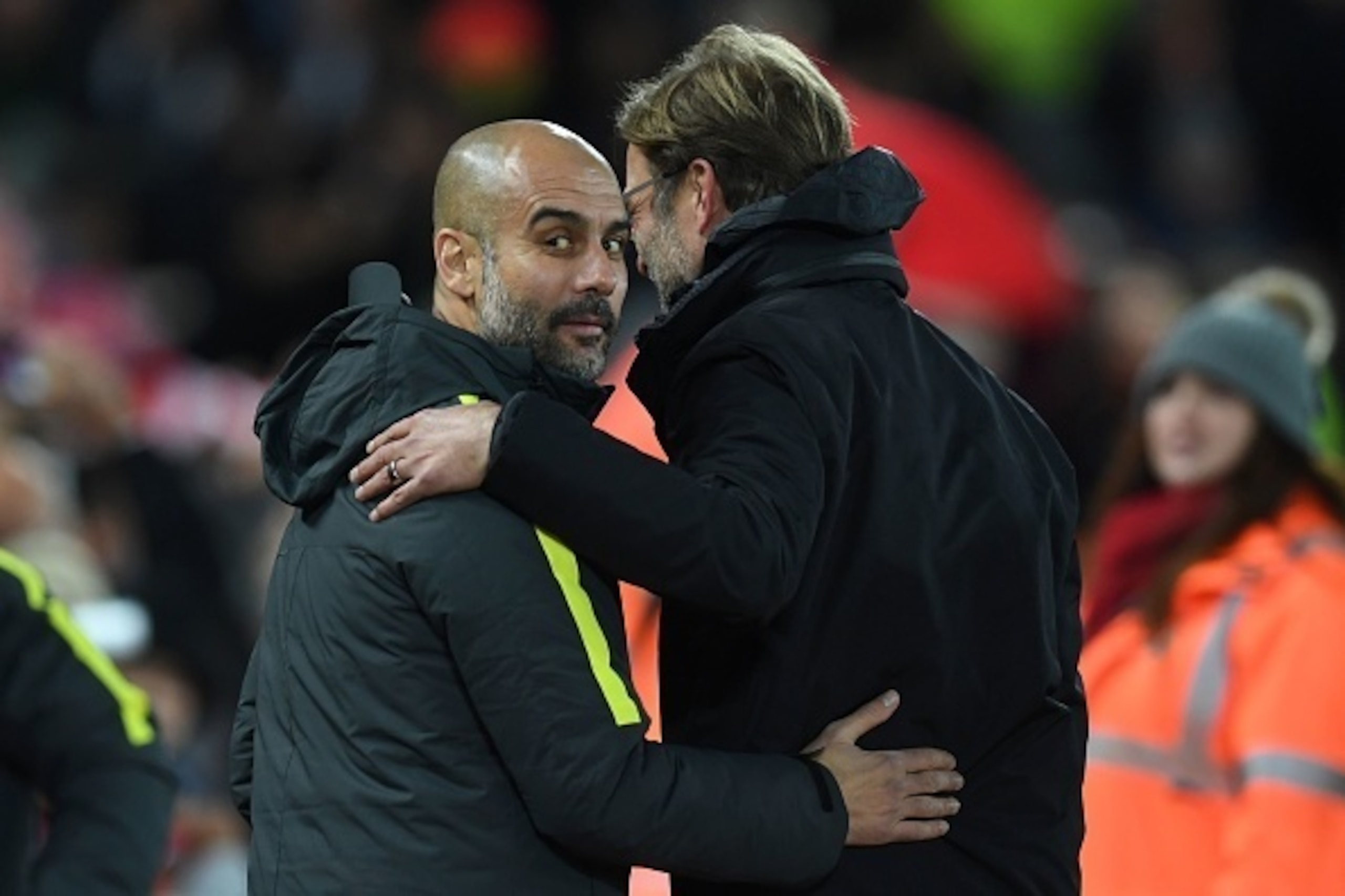Liverpool's German manager Jurgen Klopp (R) greets Manchester City's Spanish manager Pep Guardiola ahead of the English Premier League football match between Liverpool and Manchester City at Anfield in Liverpool, north west England on December 31, 2016. /