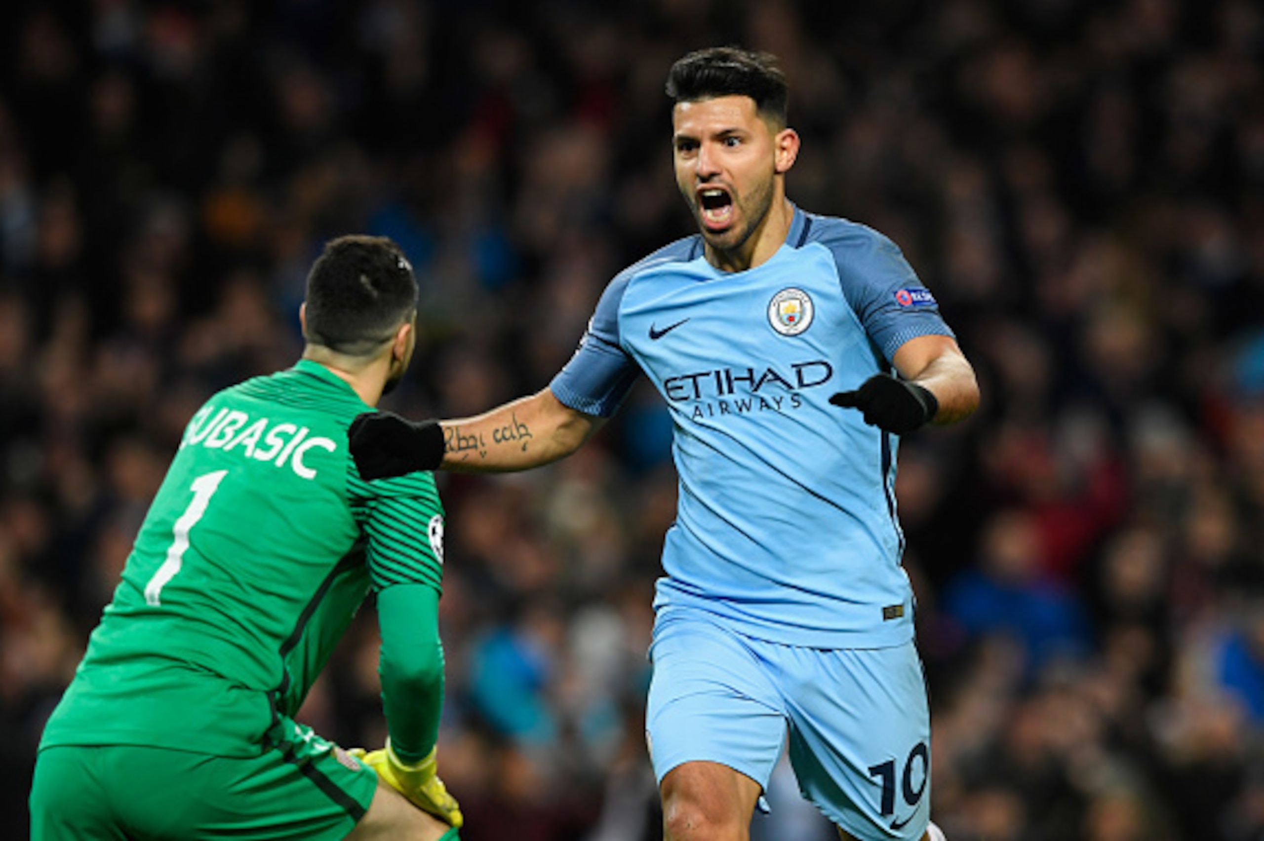 MANCHESTER, ENGLAND - FEBRUARY 21:  Sergio Aguero of Manchester City (10) celebrates as he scores their second goal during the UEFA Champions League Round of 16 first leg match between Manchester City FC and AS Monaco at Etihad Stadium on February 21, 201