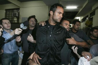 Brazilian footballer Bruno Fernandes de Souza, is taken into custody July 7, 2010 in Rio de Janeiro, Brazil. Fernandes de Sousa, a star goalkeeper for the popular Brazilian club Flamengo, surrendered to police Wednesday to face questioning in connection w