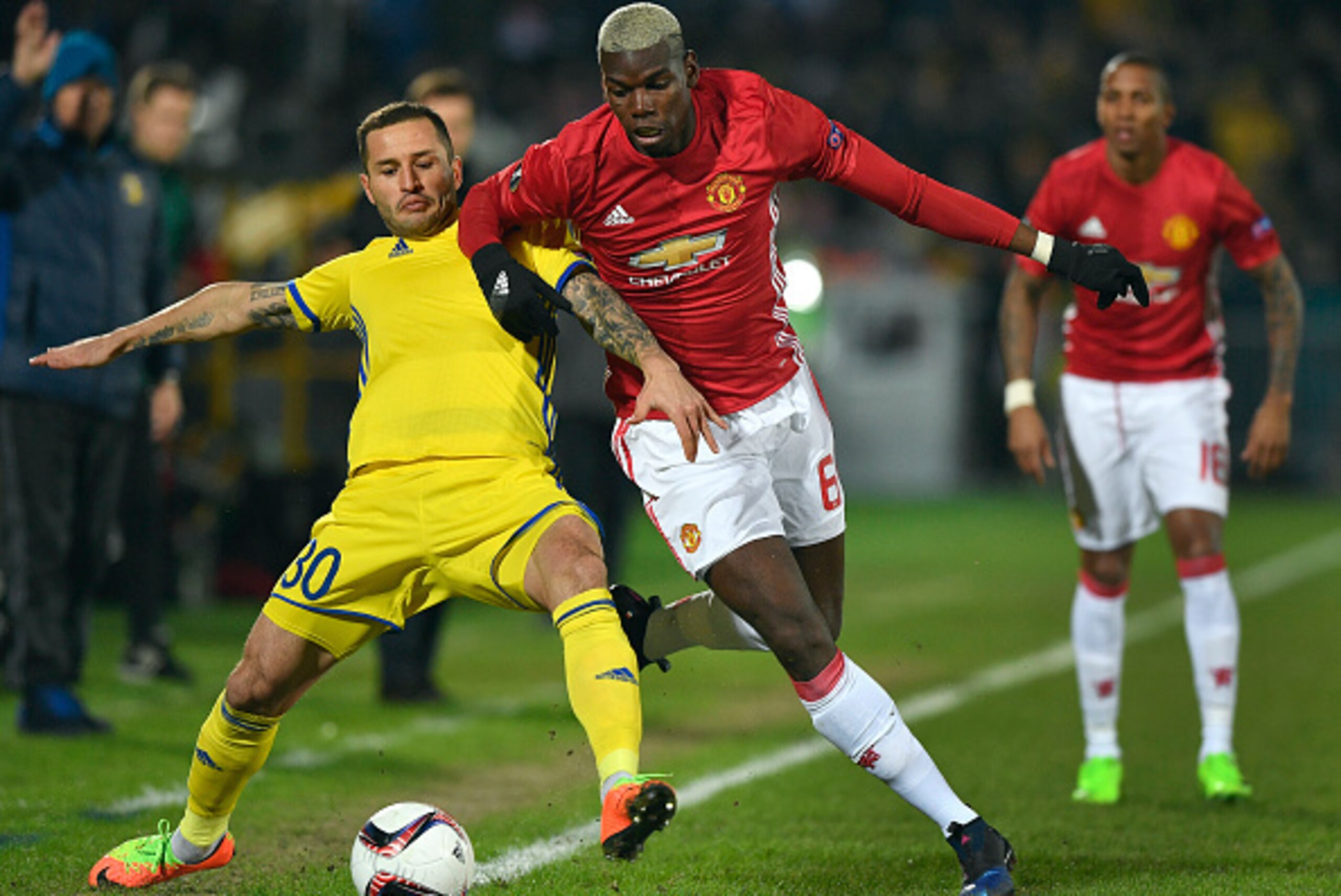 Manchester United's French midfielder Paul Pogba (R) fights for the ball with Rostov's defender Fedor Kudryashov (L) during the UEFA Europa League round of 16 football match between Rostov and Manchester United at Olimp-2 Arena in Rostov-on-Don on March 9