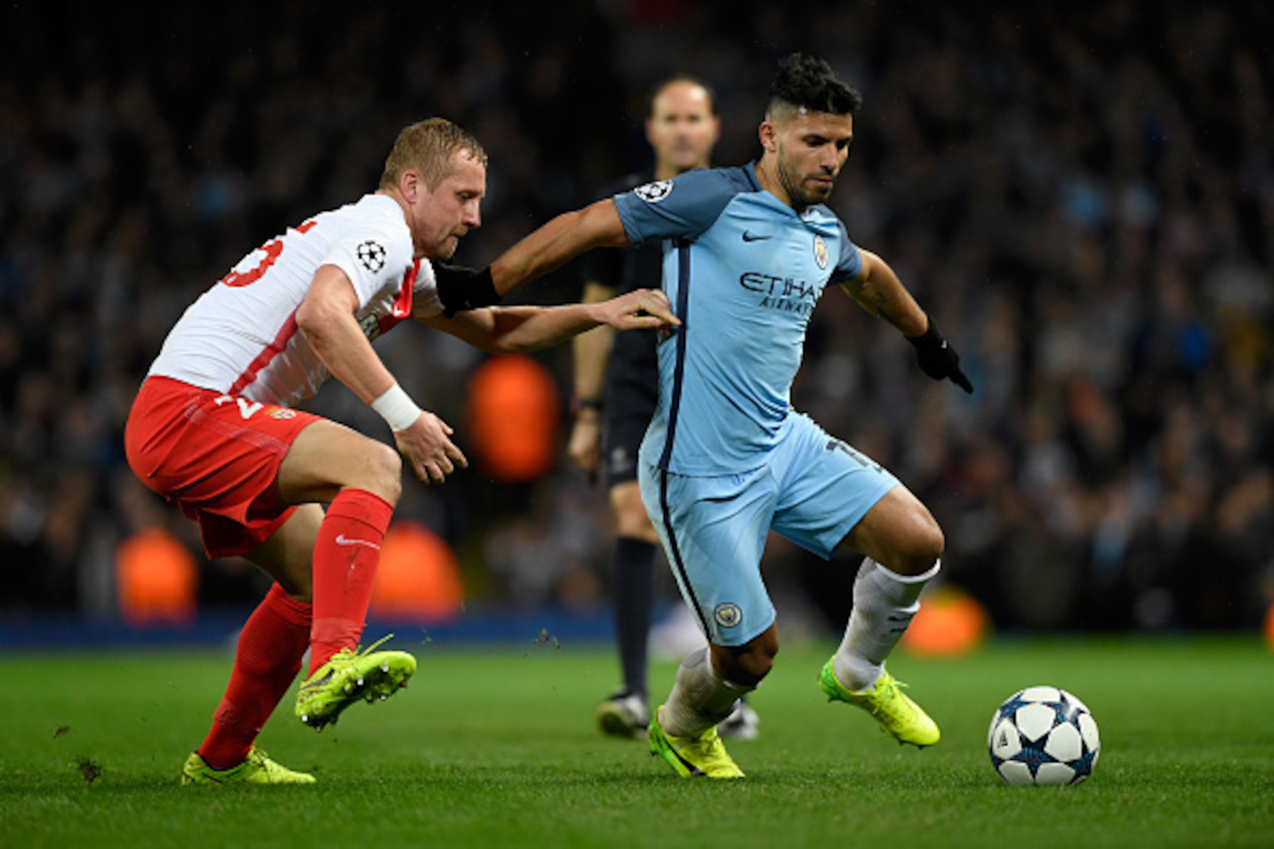 MANCHESTER, ENGLAND - FEBRUARY 21:  Manchester City striker Sergio Aguero holds off the challenge of Kamil Glik during the UEFA Champions League Round of 16 first leg match between Manchester City FC and AS Monaco at Etihad Stadium on February 21, 2017 in
