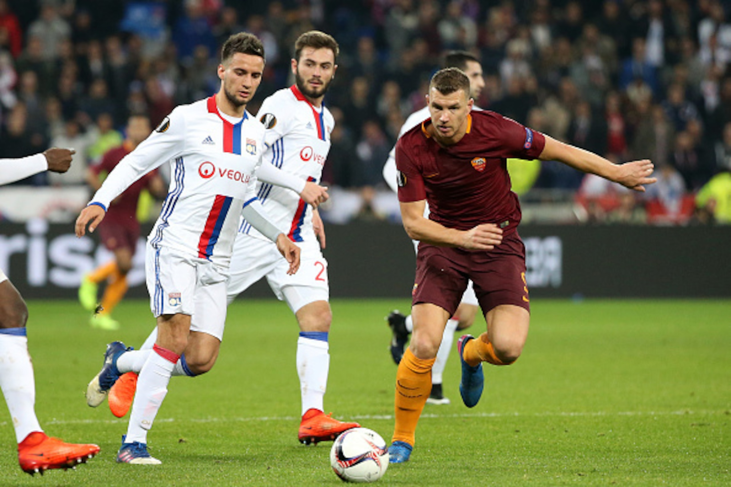 LYON, FRANCE - MARCH 9: Edin Dzeko of AS Roma and Emanuel Mammana of Lyonj (left) in action during the UEFA Europa League Round of 16 first leg match between Olympique Lyonnais (OL) and AS Roma at Parc OL on March 9, 2017 in Lyon, France. (Photo by Jean C LYON, FRANCE - MARCH 9: Edin Dzeko of AS Roma and Emanuel Mammana of Lyonj (left) in action during the UEFA Europa League Round of 16 first leg match between Olympique Lyonnais (OL) and AS Roma at Parc OL on March 9, 2017 in Lyon, France. (Photo by Jean C
