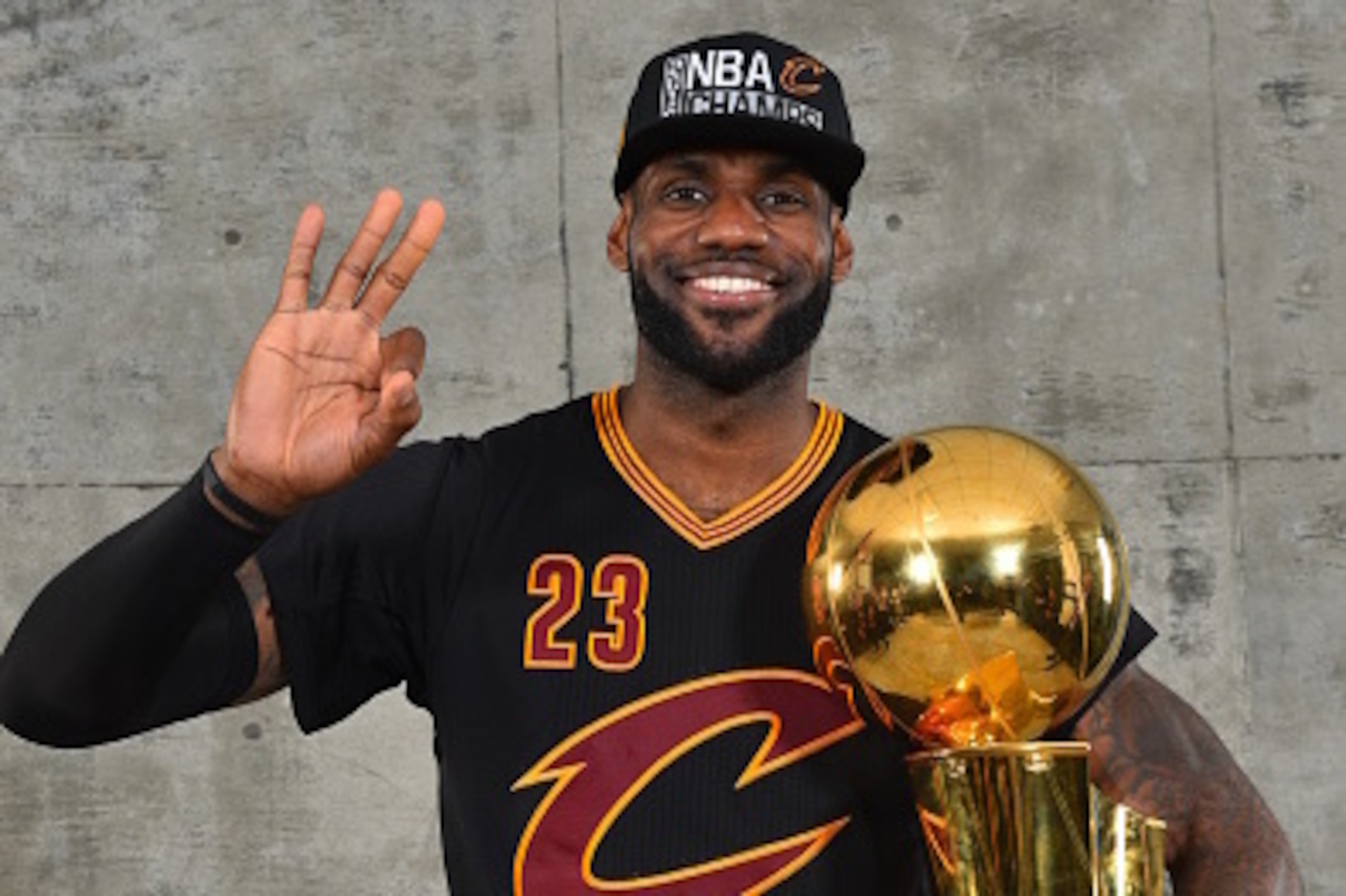 OAKLAND, CA - JUNE 19:  LeBron James #23 of the Cleveland Cavaliers poses for a portrait with the World Championship Trophy after winning the NBA Championship against the Golden State Warriors during the 2016 NBA Finals Game Seven on June 19, 2016 at ORAC