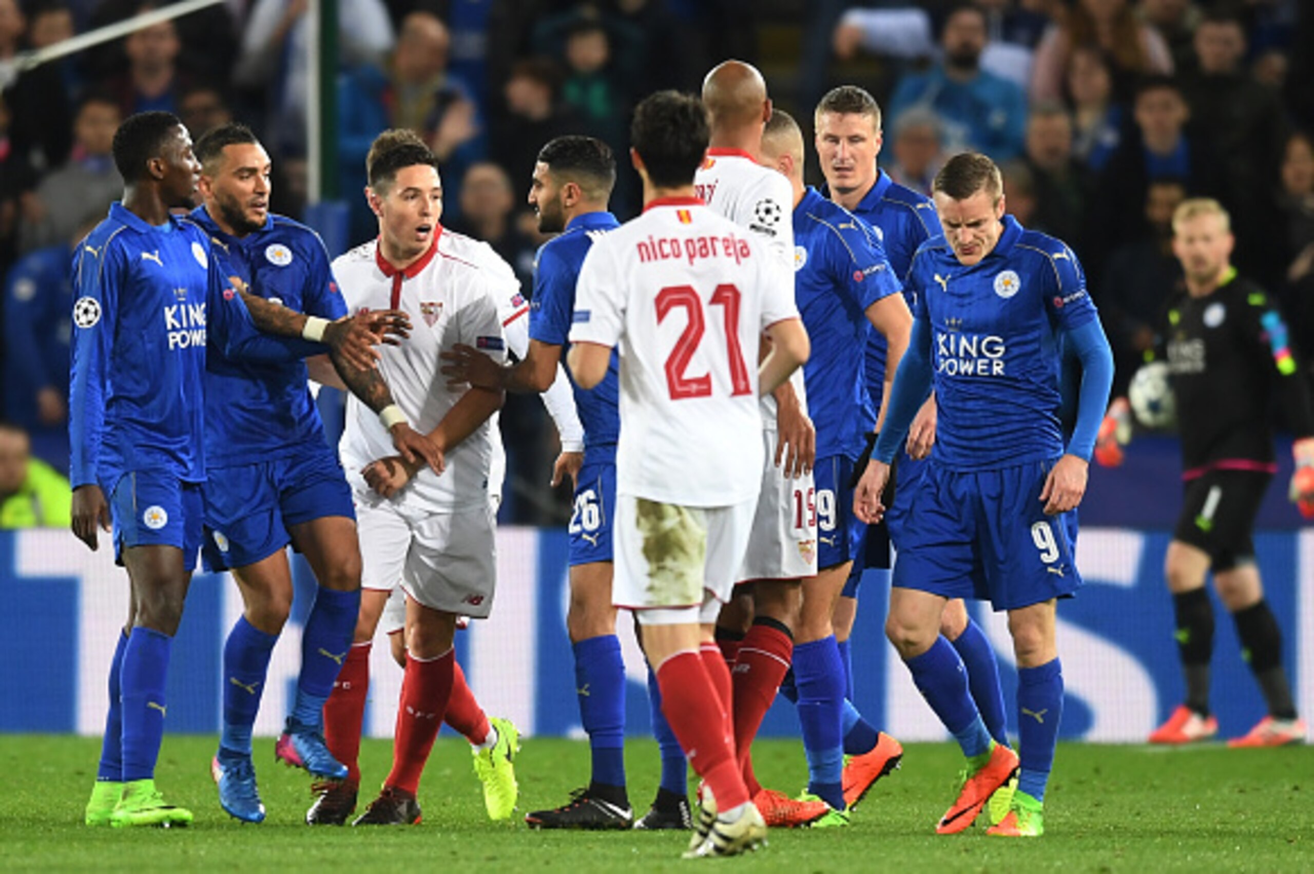 LEICESTER, ENGLAND - MARCH 14:  Samir Nasri #10 of Sevilla and Jamie Vardy #9 of Leicester City clash after Nasri was shown a red card during the UEFA Champions League Round of 16, second leg match between Leicester City and Sevilla FC at The King Power S