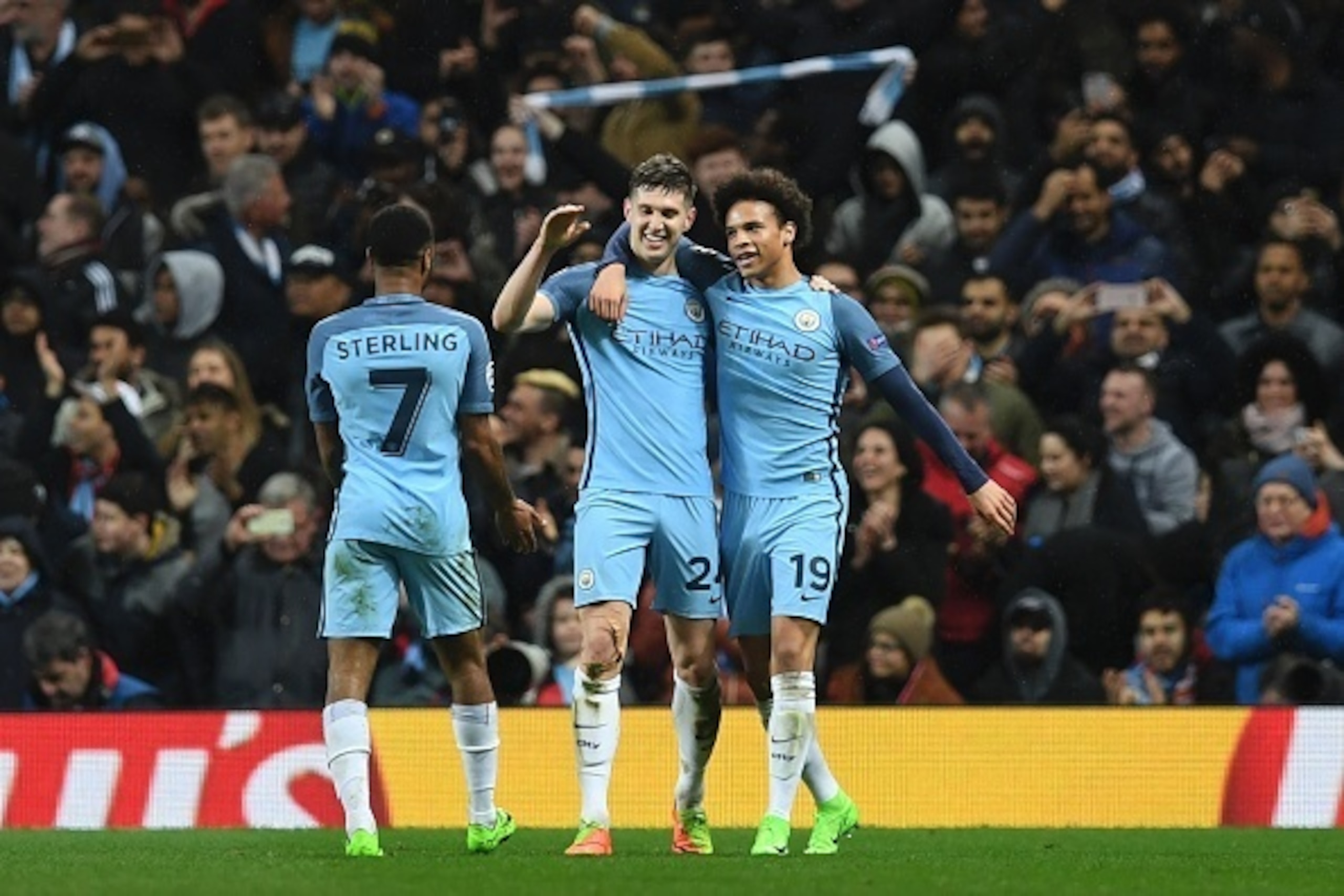 Manchester City's English defender John Stones (C) celebrates scoring their fourth goal during the UEFA Champions League Round of 16 first-leg football match between Manchester City and Monaco at the Etihad Stadium in Manchester, north west England on Feb