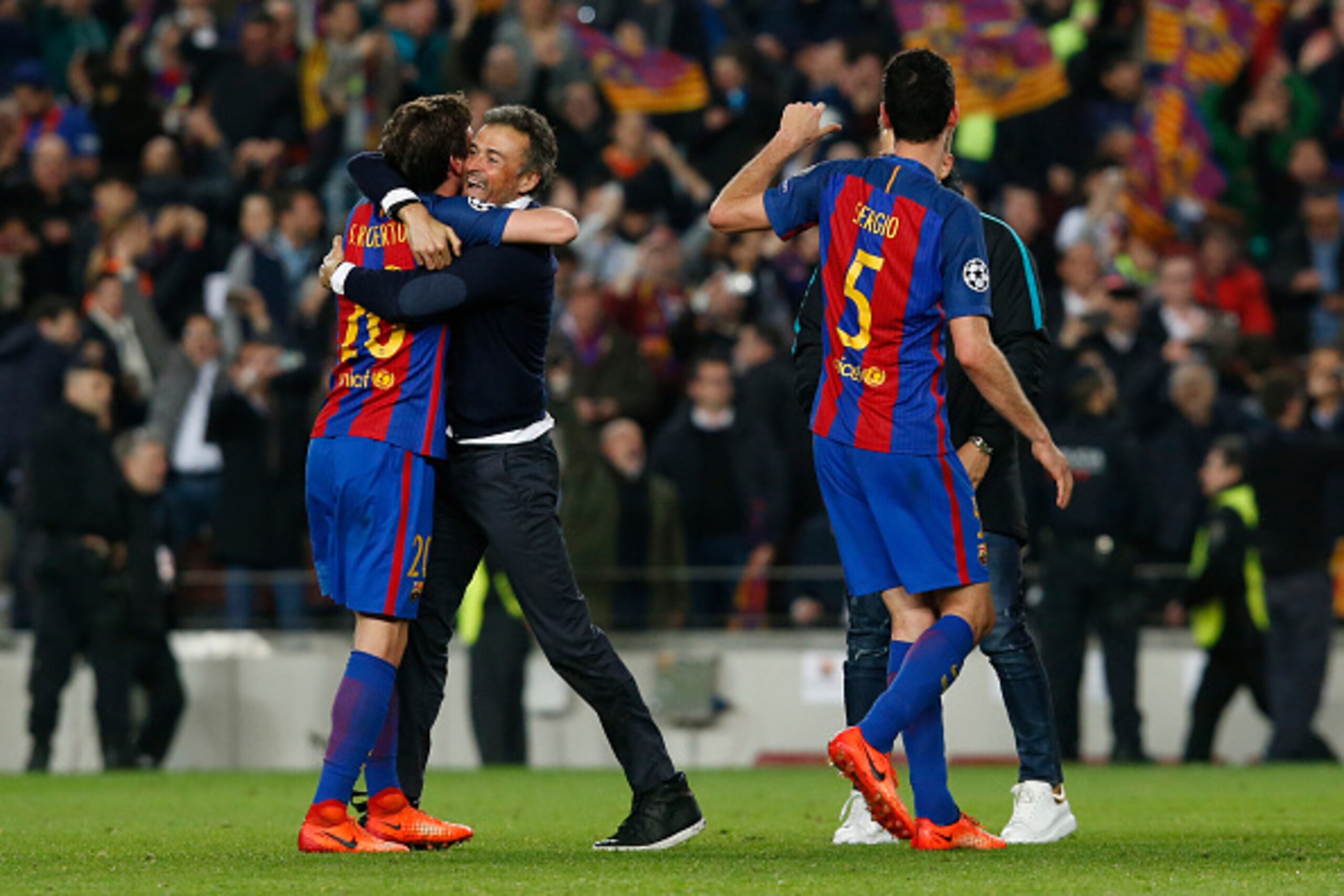 Barcelona's midfielder Sergi Roberto (L) hugs Barcelona's coach Luis Enrique as they celebrate their victory at the end of the UEFA Champions League round of 16 second leg football match FC Barcelona vs Paris Saint-Germain FC at the Camp Nou stadium in Ba Barcelona's midfielder Sergi Roberto (L) hugs Barcelona's coach Luis Enrique as they celebrate their victory at the end of the UEFA Champions League round of 16 second leg football match FC Barcelona vs Paris Saint-Germain FC at the Camp Nou stadium in Ba