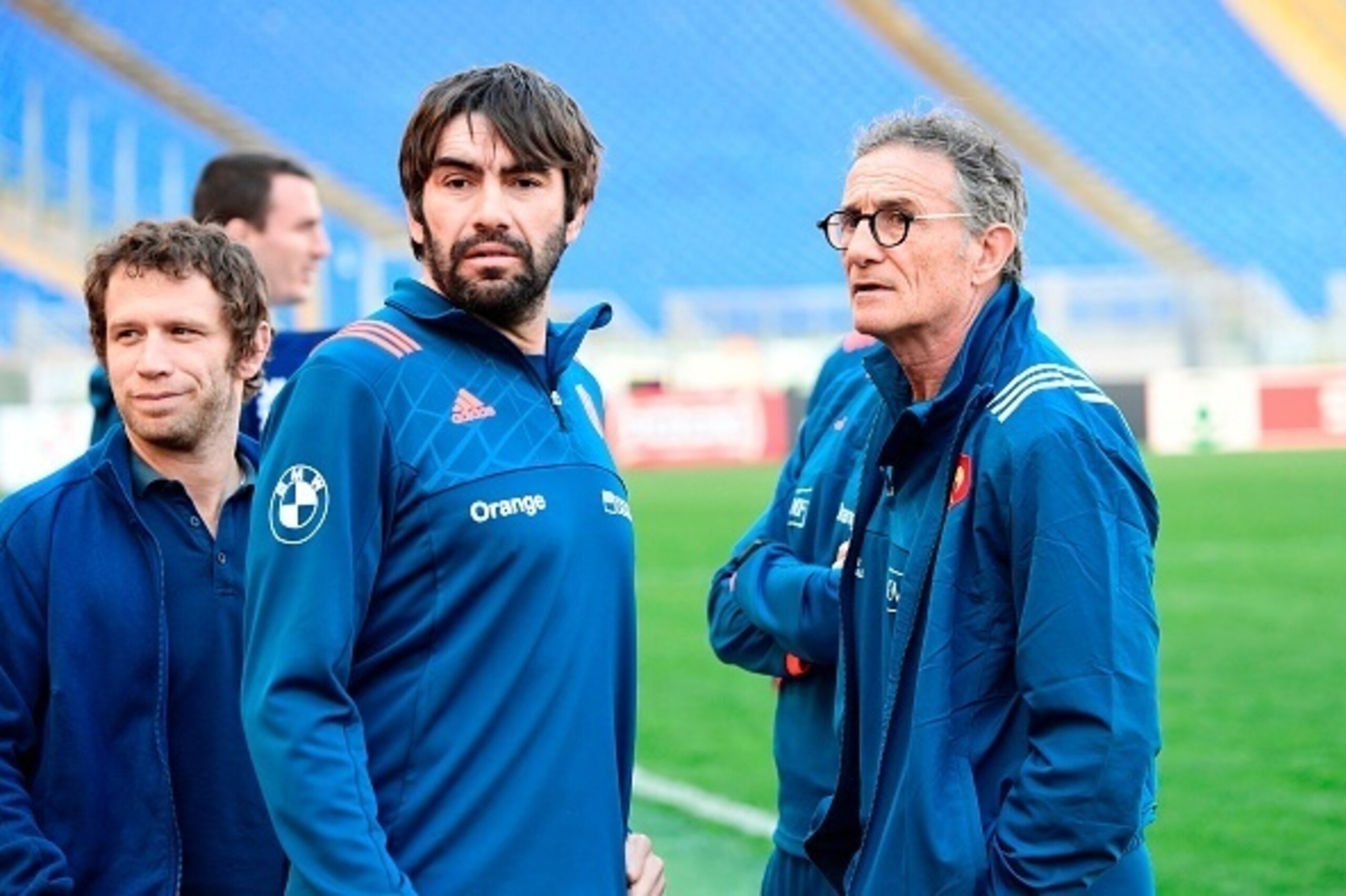 France's backs coach Jean-Frederic Dubois (C) and France's coach Guy Noves (R) attend the Captain's Run on the eve of the Six Nations International rugby union match between Italy and France on March 10, 2017 at the Olympic stadium in Rome. / AFP PHOTO / 