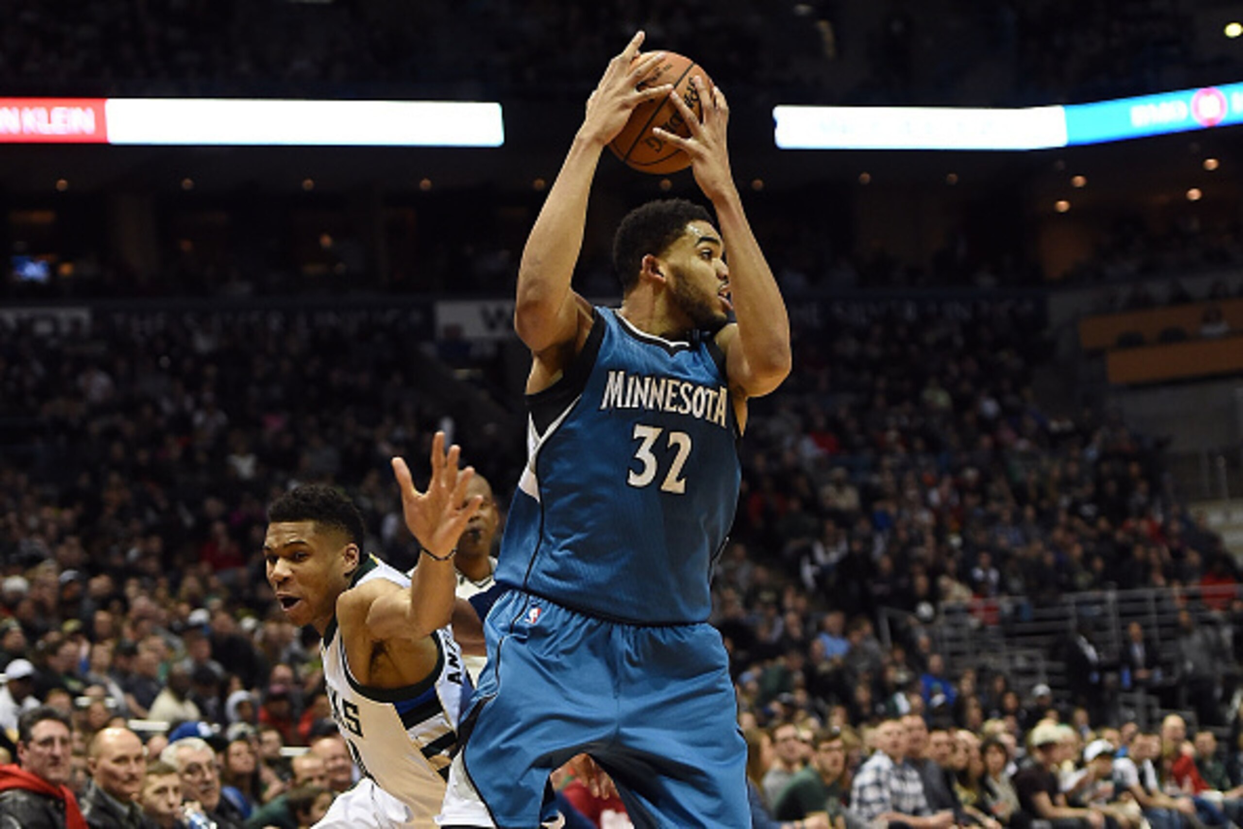 MILWAUKEE, WI - MARCH 11:  Karl-Anthony Towns #32 of the Minnesota Timberwolves grabs a loose ball from Giannis Antetokounmpo #34 of the Milwaukee Bucks during a game at the BMO Harris Bradley Center on March 11, 2017 in Milwaukee, Wisconsin.  NOTE TO USE