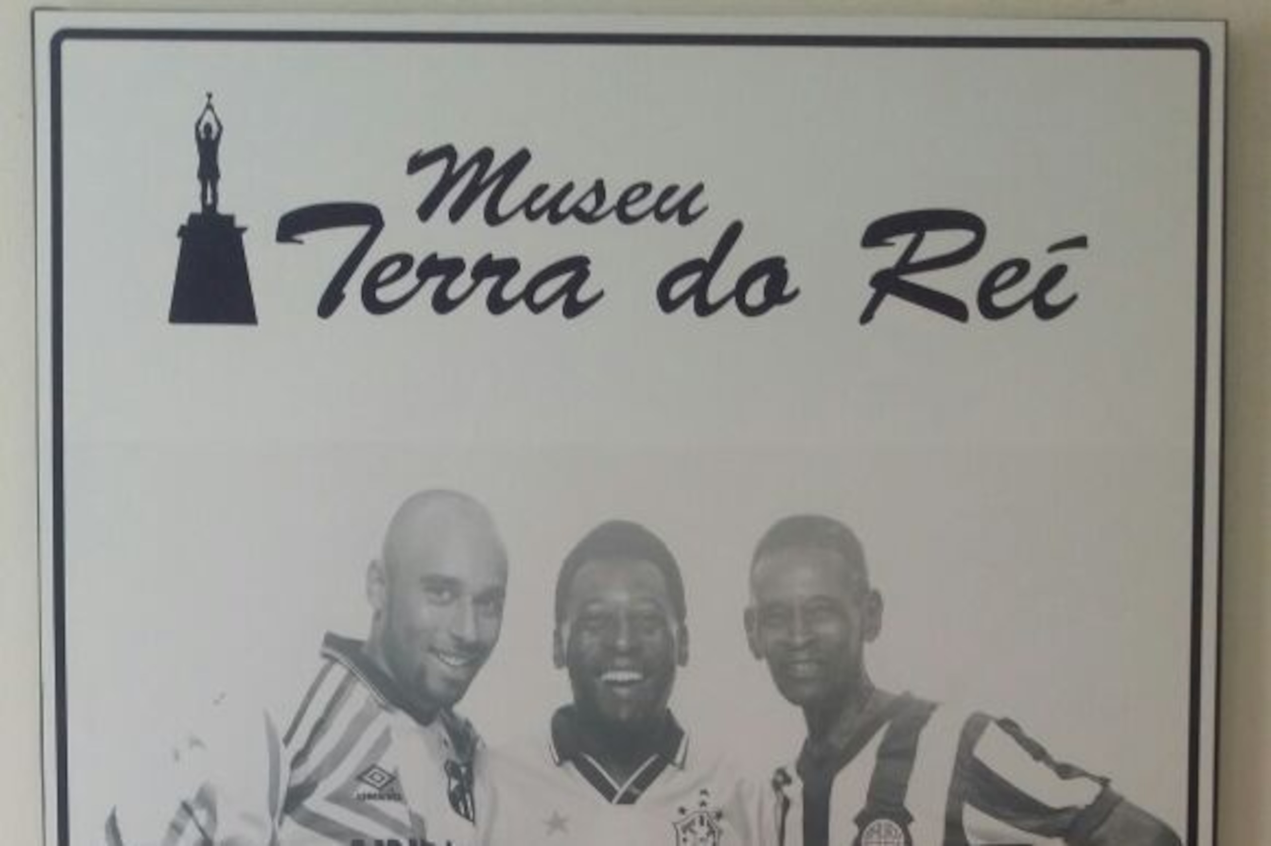 A poster of Edinho (left), Pele and Pele's father Dondinho, with each portrayed in their playing days