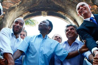 Edinho (left) joins Pele as he sets the cornerstone for the Pele Museum, in Santos, in July 2010