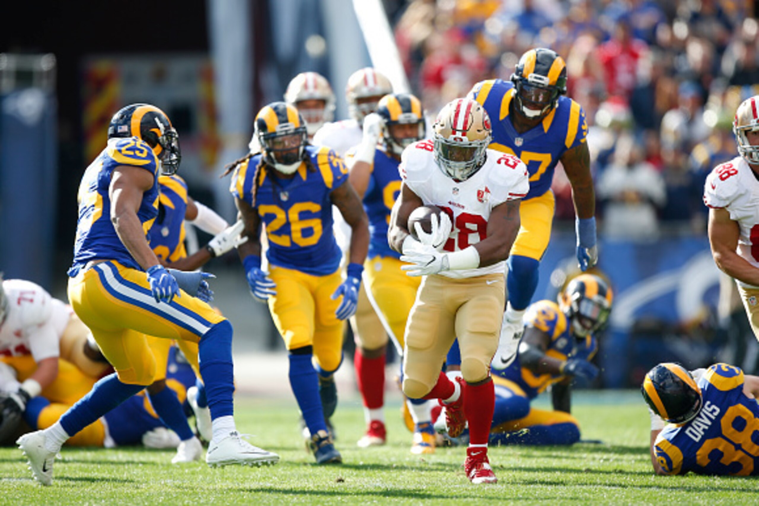 LOS ANGELES, CA - DECEMBER, 24: Carlos Hyde #28 of the San Francisco 49ers rushes up the middle during the game against the Los Angeles Rams at the Los Angeles Coliseum on December 24, 2016 in Los Angeles, California. The 49ers defeated the Rams 22-21. (P