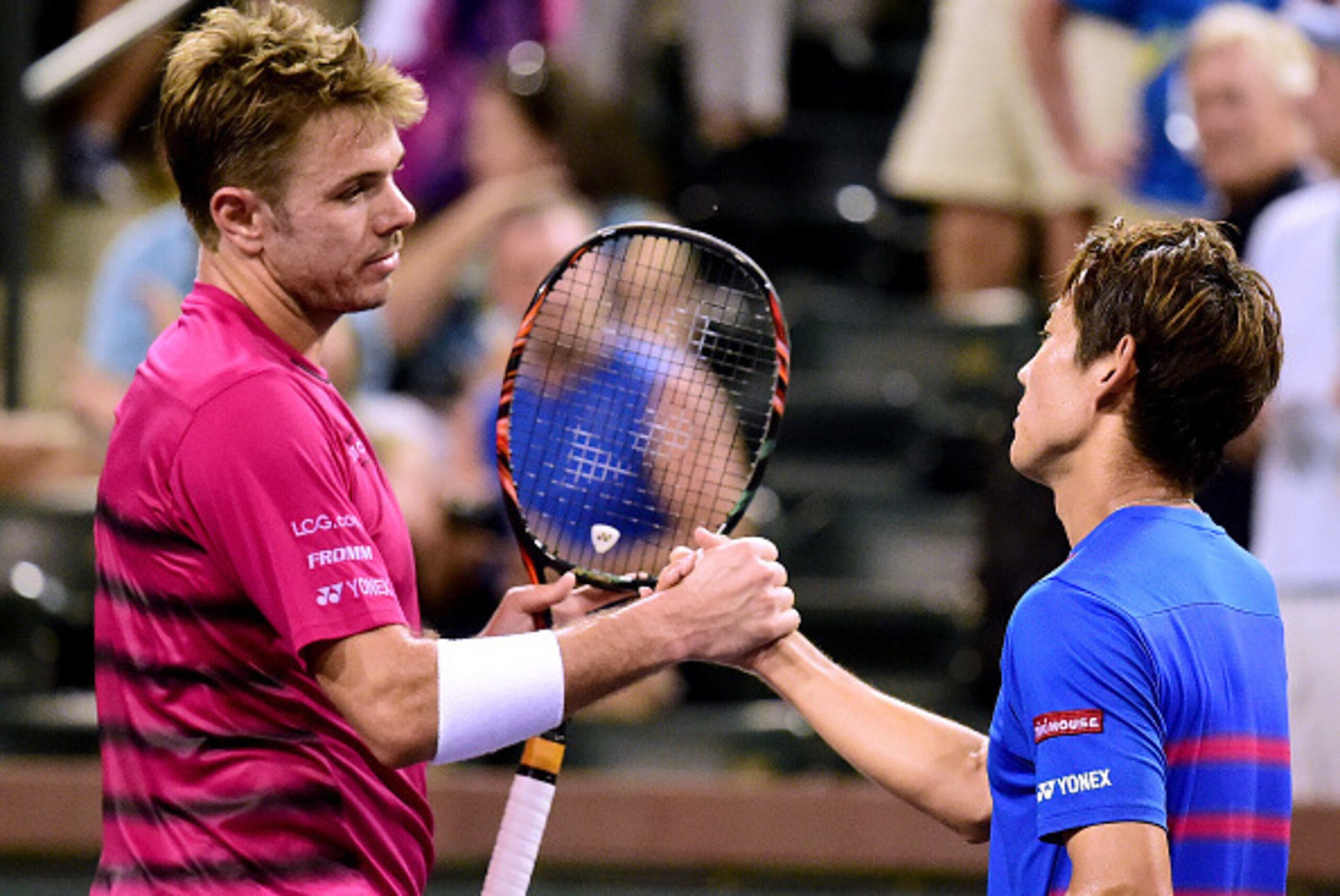 INDIAN WELLS, CA - MARCH 15: Stan Wawrinka of Switzerland shakes hands with Yoshihito Nishioka of Japan after beating him during the BNP Paribas at Indian Wells Tennis Garden on March 15, 2017 in Indian Wells, California. (Photo by Harry How/Getty Image INDIAN WELLS, CA - MARCH 15: Stan Wawrinka of Switzerland shakes hands with Yoshihito Nishioka of Japan after beating him during the BNP Paribas at Indian Wells Tennis Garden on March 15, 2017 in Indian Wells, California. (Photo by Harry How/Getty Image