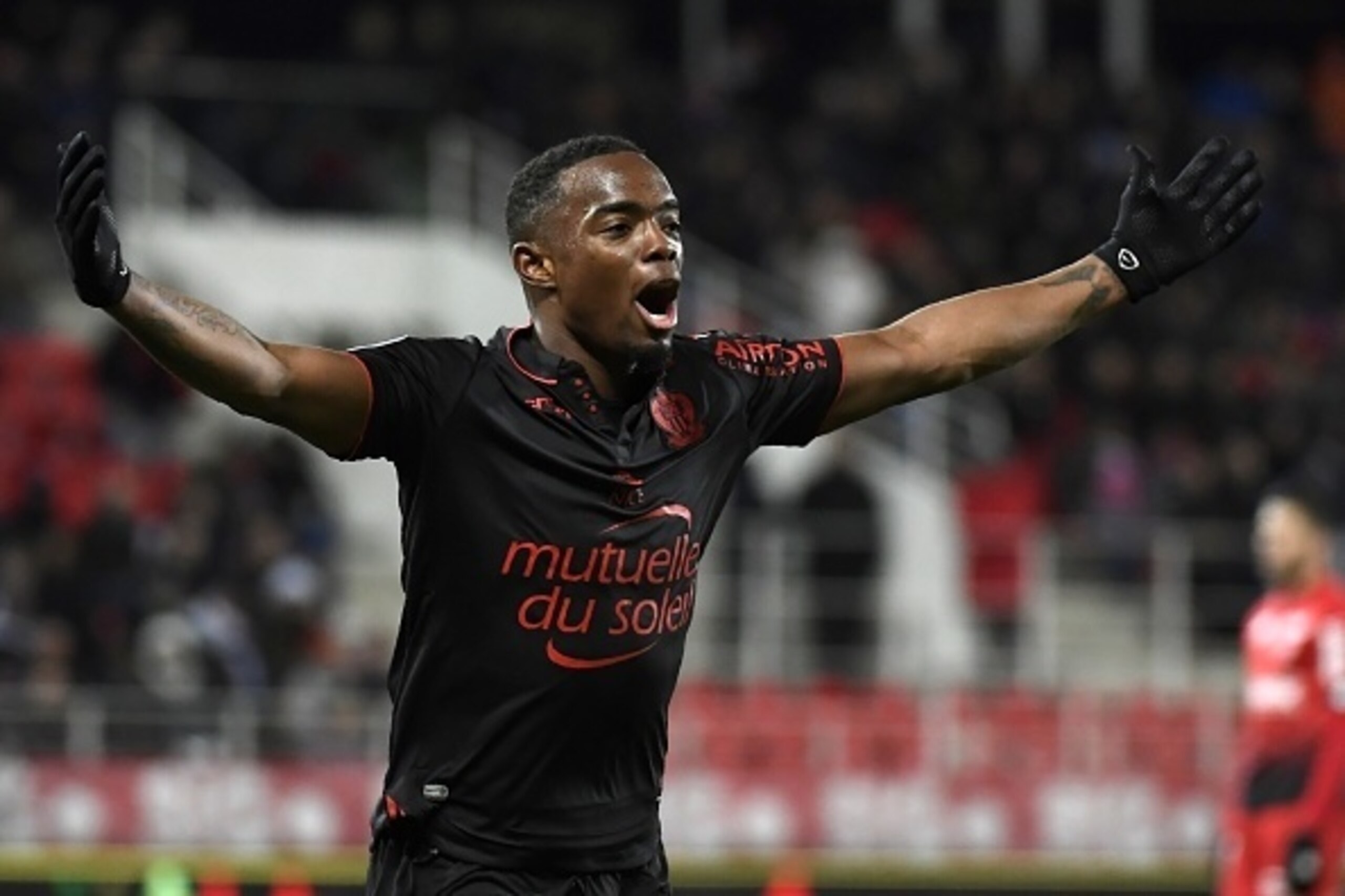 Nice's French midfielder Wylan Cyprien celebrates after scoring a goal during the French L1 football match Dijon (DFCO) against OGC Nice on March 4, 2017 at the Gaston-Gerard Stadium in Dijon, central eastern France. / AFP PHOTO / PHILIPPE DESMAZES       