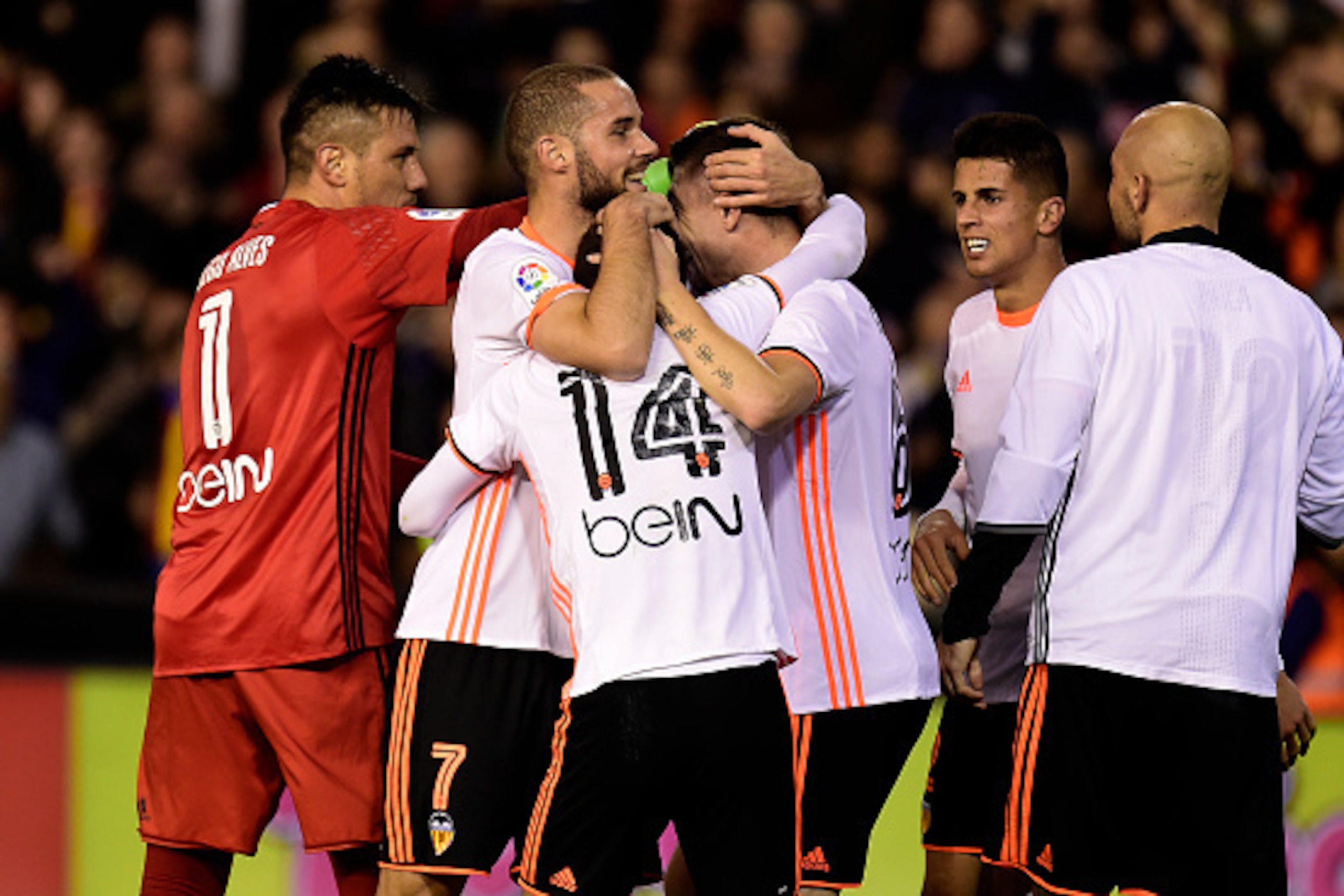 Valencia's players celebrates after the Spanish league football match Valencia CF vs Real Madrid CF at the Mestalla stadium in Valencia on February 22, 2017. / AFP / JOSE JORDAN        (Photo credit should read JOSE JORDAN/AFP/Getty Images)