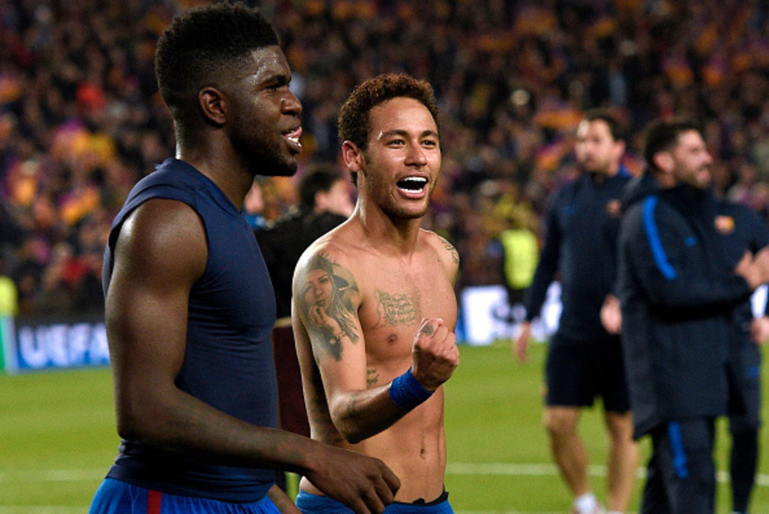 Barcelona's Brazilian forward Neymar (C) and Barcelona's French defender Samuel Umtiti (L) celebrate at the end of the UEFA Champions League round of 16 second leg football match FC Barcelona vs Paris Saint-Germain FC at the Camp Nou stadium in Barcelona 