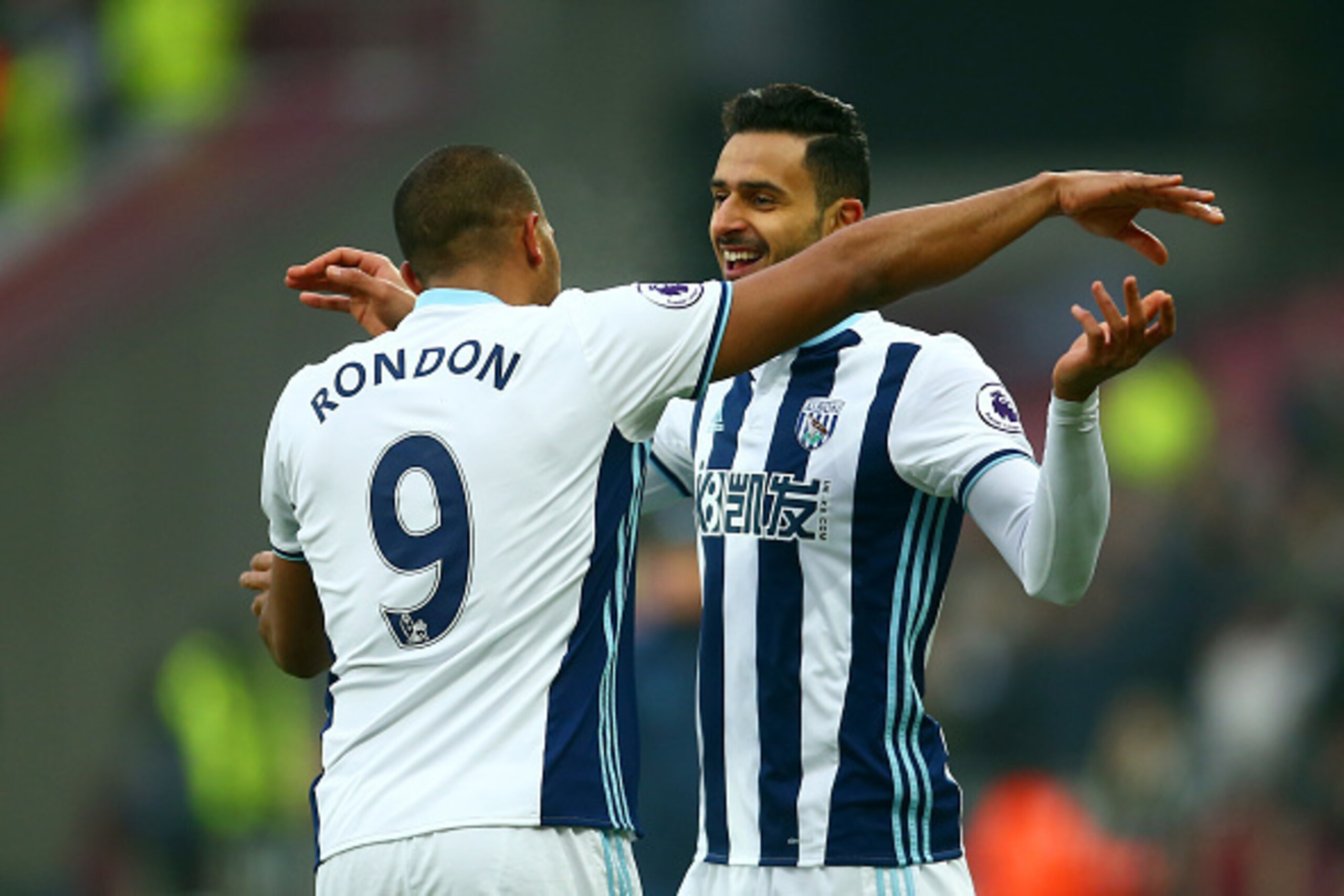 STRATFORD, ENGLAND - FEBRUARY 11:  Nacer Chadli (R) of West Bromwich Albion celebrates scoring the opening goal with his team mate Jose Salomon Rondon (L) during the Premier League match between West Ham United and West Bromwich Albion at London Stadium o