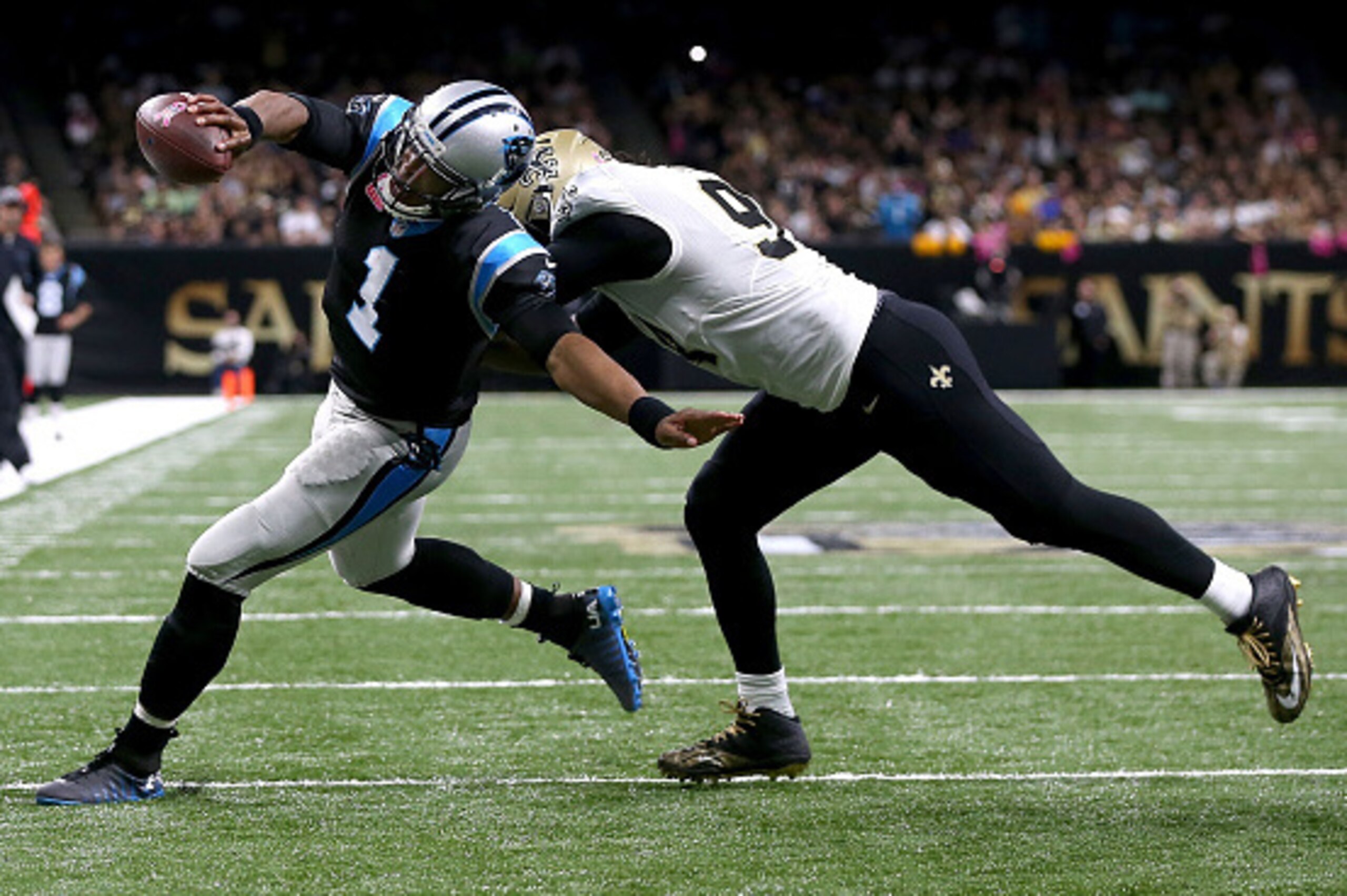 NEW ORLEANS, LA - OCTOBER 16:  Cam Newton #1 of the Carolina Panthers scores a touchdown against Cameron Jordan #94 of the New Orleans Saints at the Mercedes-Benz Superdome on October 16, 2016 in New Orleans, Louisiana.  (Photo by Sean Gardner/Getty Image