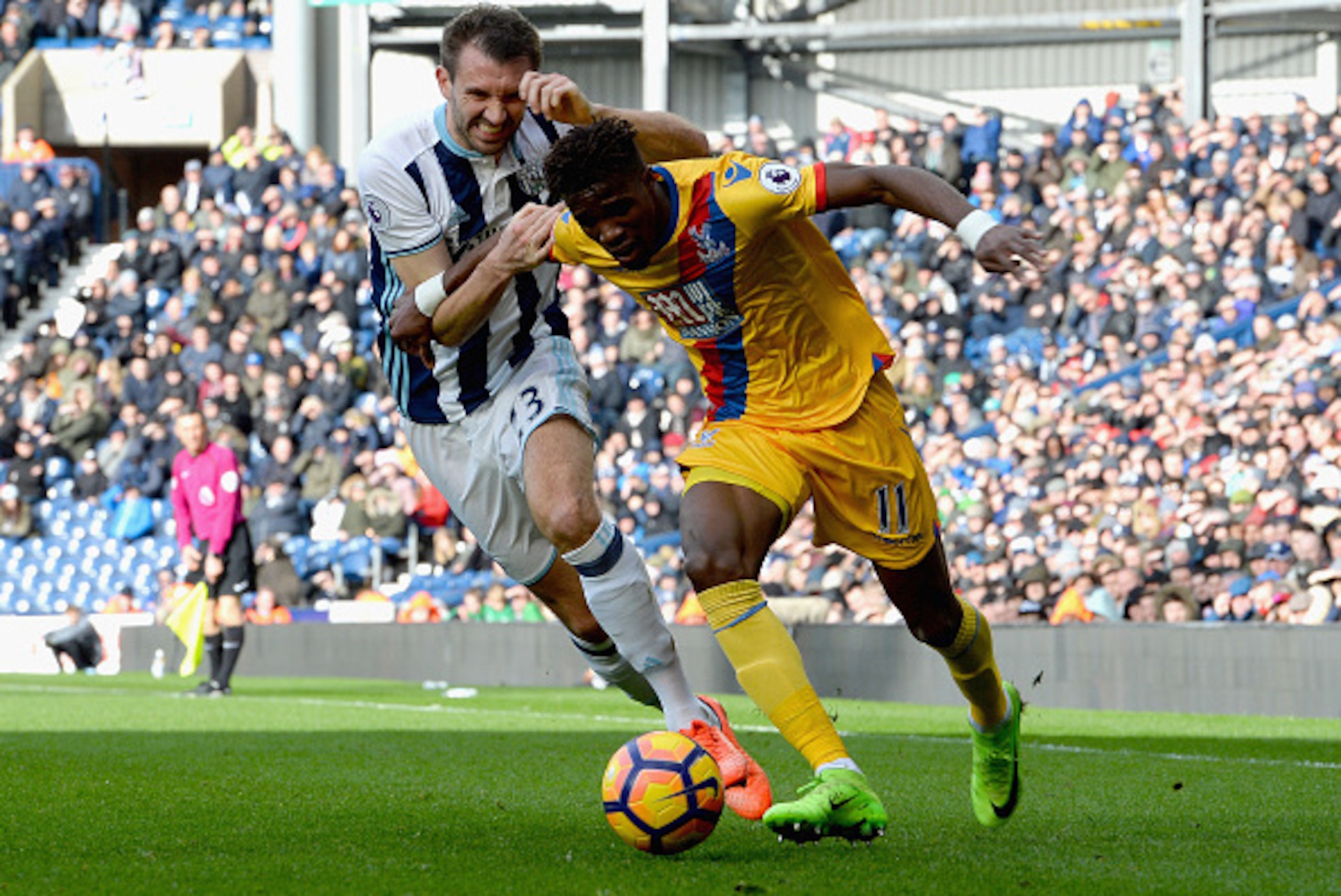 WEST BROMWICH, ENGLAND - MARCH 04:  Gareth McAuley of West Bromwich Albion challenges Wilfried Zaha of Crystal Palace during the Premier League match between West Bromwich Albion and Crystal Palace at The Hawthorns on March 4, 2017 in West Bromwich, Engla