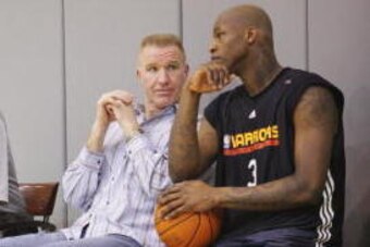 OAKLAND - JANUARY 19: Al Harrington (#3), sits with General Manager Rod Higgins and Vice President of Basketball Operations Chris Mullin of the Golden State Warriors after his first practice at the Warriors Practice Facility on January 19, 2007  in Oaklan