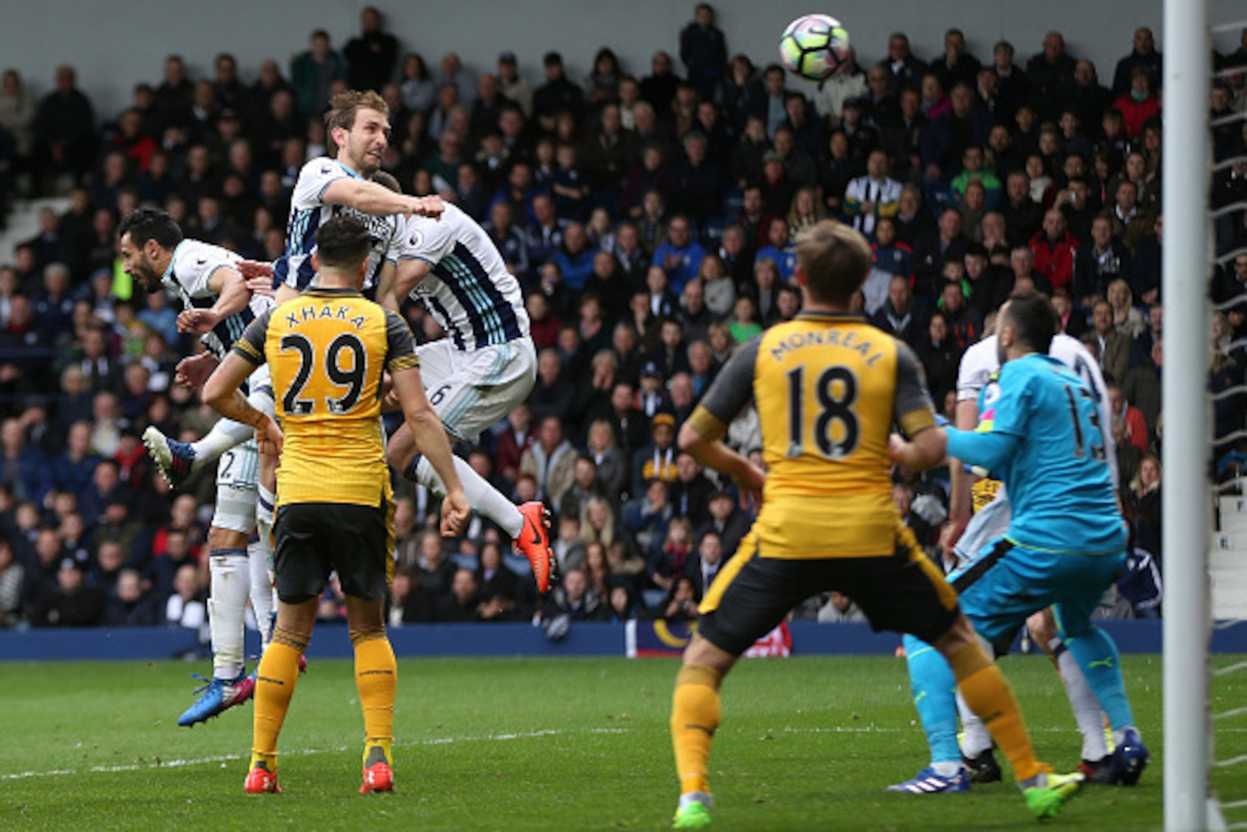 WEST BROMWICH, ENGLAND - MARCH 18:  Craig Dawson of West Bromwich Albion (L) scores his sides third goal during the Premier League match between West Bromwich Albion and Arsenal at The Hawthorns on March 18, 2017 in West Bromwich, England.  (Photo by Alex