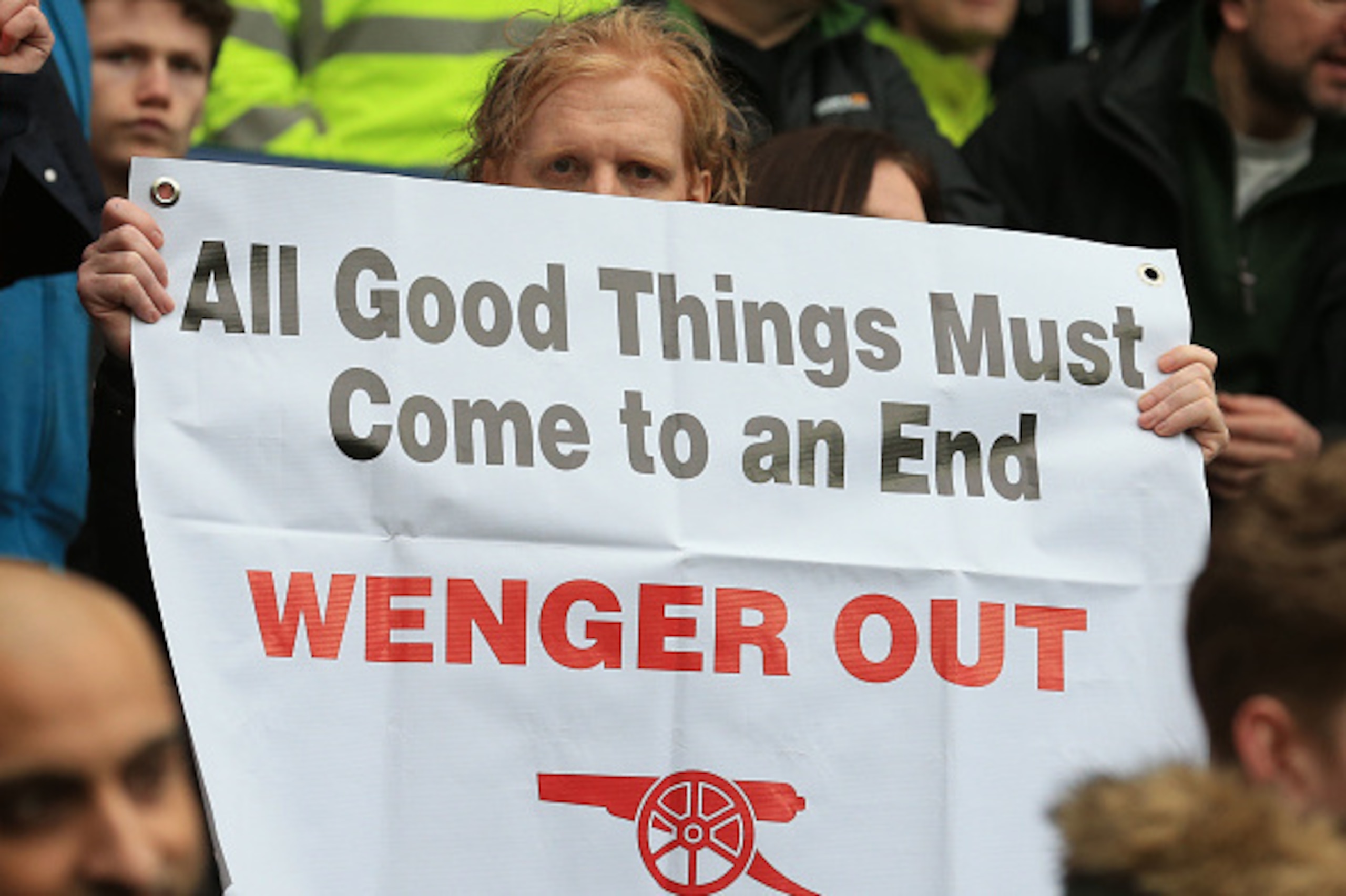 Arsenal fans hold up anti - Arsene Wenger signs after the English Premier League football match between West Bromwich Albion and Arsenal at The Hawthorns stadium in West Bromwich, central England, on March 18, 2017.
 / AFP PHOTO / Lindsey PARNABY / RESTRI