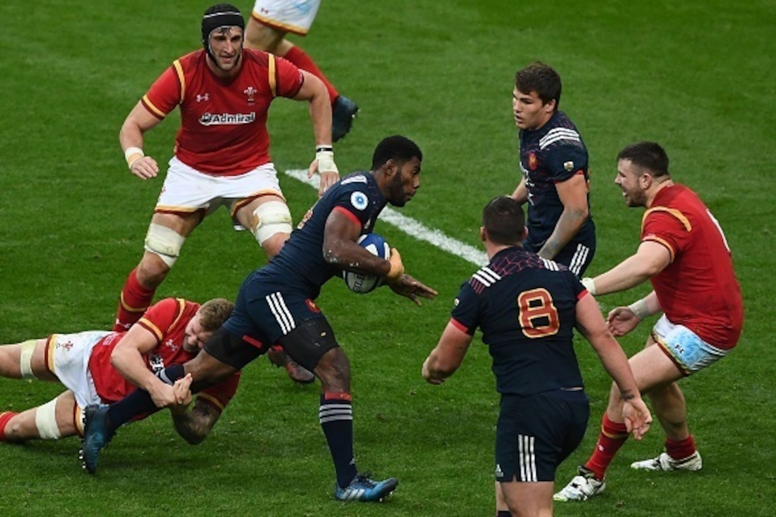 France's winger Noa Nakaitaci  (C) is tackled during the Six Nations tournament Rugby Union match between France and Wales at the Stade de France in Saint-Denis, outside Paris, on March 18, 2017.  / AFP PHOTO / GABRIEL BOUYS        (Photo credit should re