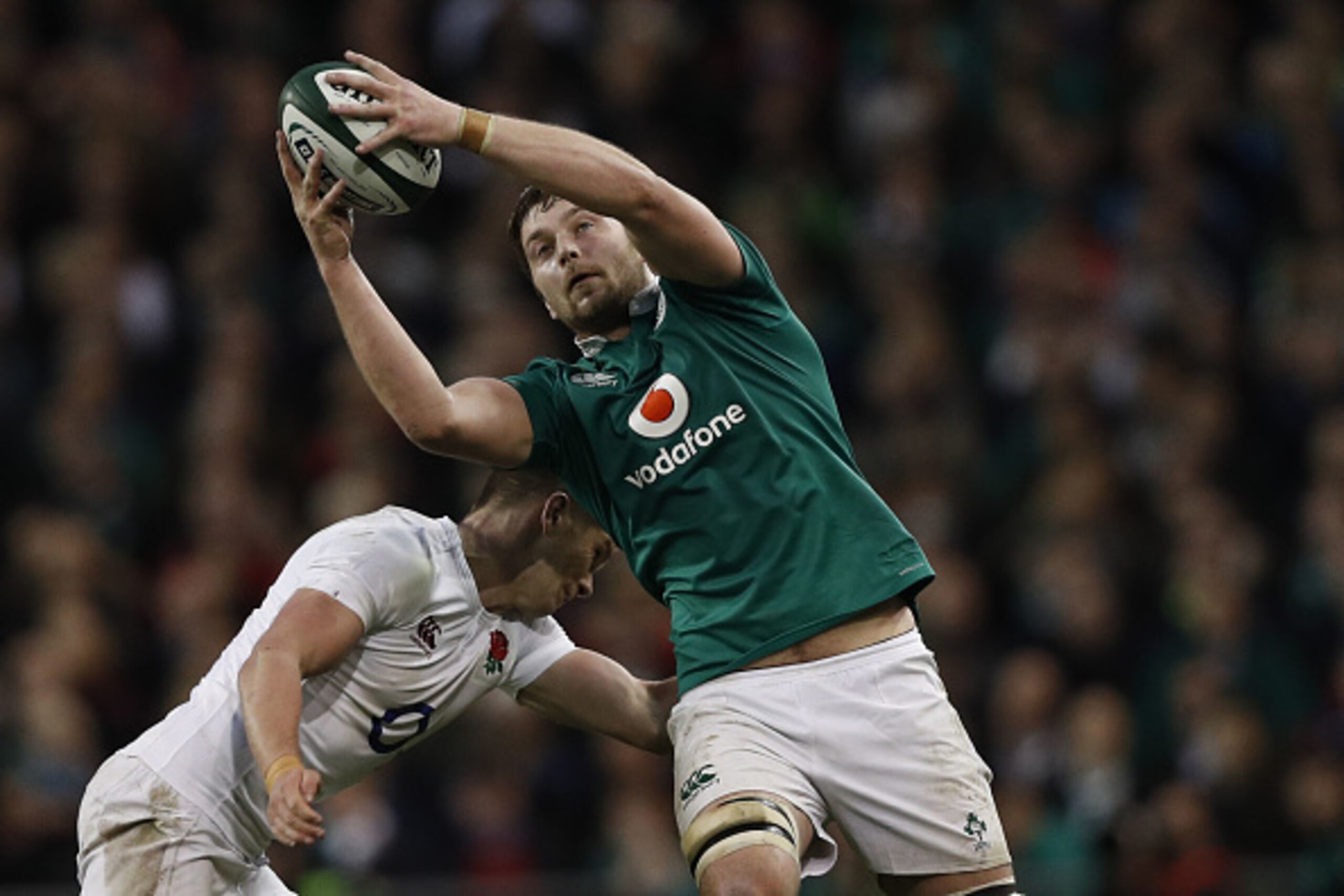 Ireland's lock Iain Henderson (R) is tackled by England's centre Owen Farrell during the Six Nations international rugby union match between Ireland and England at the Aviva Stadium in Dublin on March 18, 2017.   / AFP PHOTO / Adrian DENNIS        (Photo 