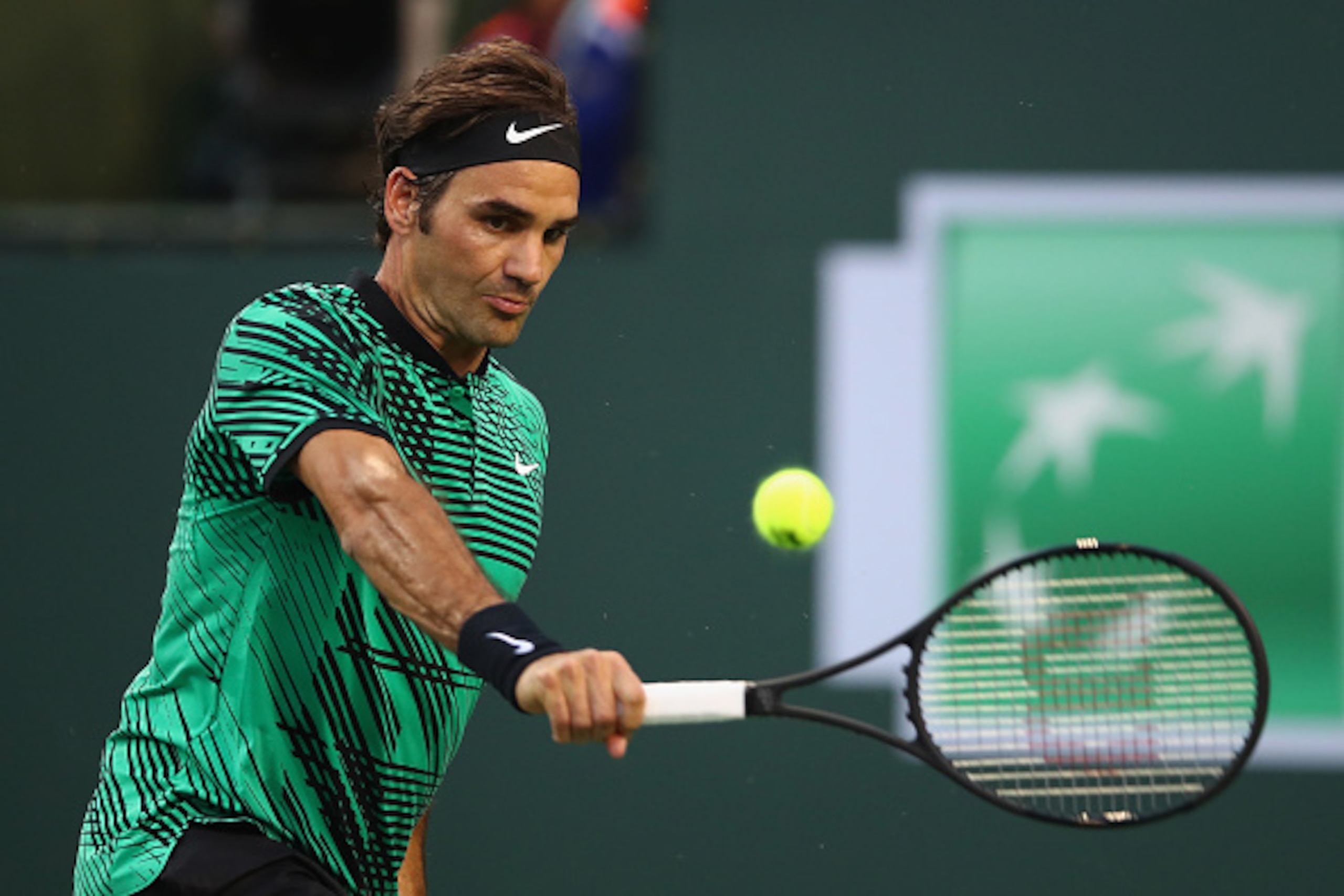 INDIAN WELLS, CA - MARCH 15:  Roger Federer of Switzerland plays a backhand during his straight sets victory against Rafael Nadal of Spain in their fourth round match during day ten of the BNP Paribas Open at Indian Wells Tennis Garden on March 15, 2017 i
