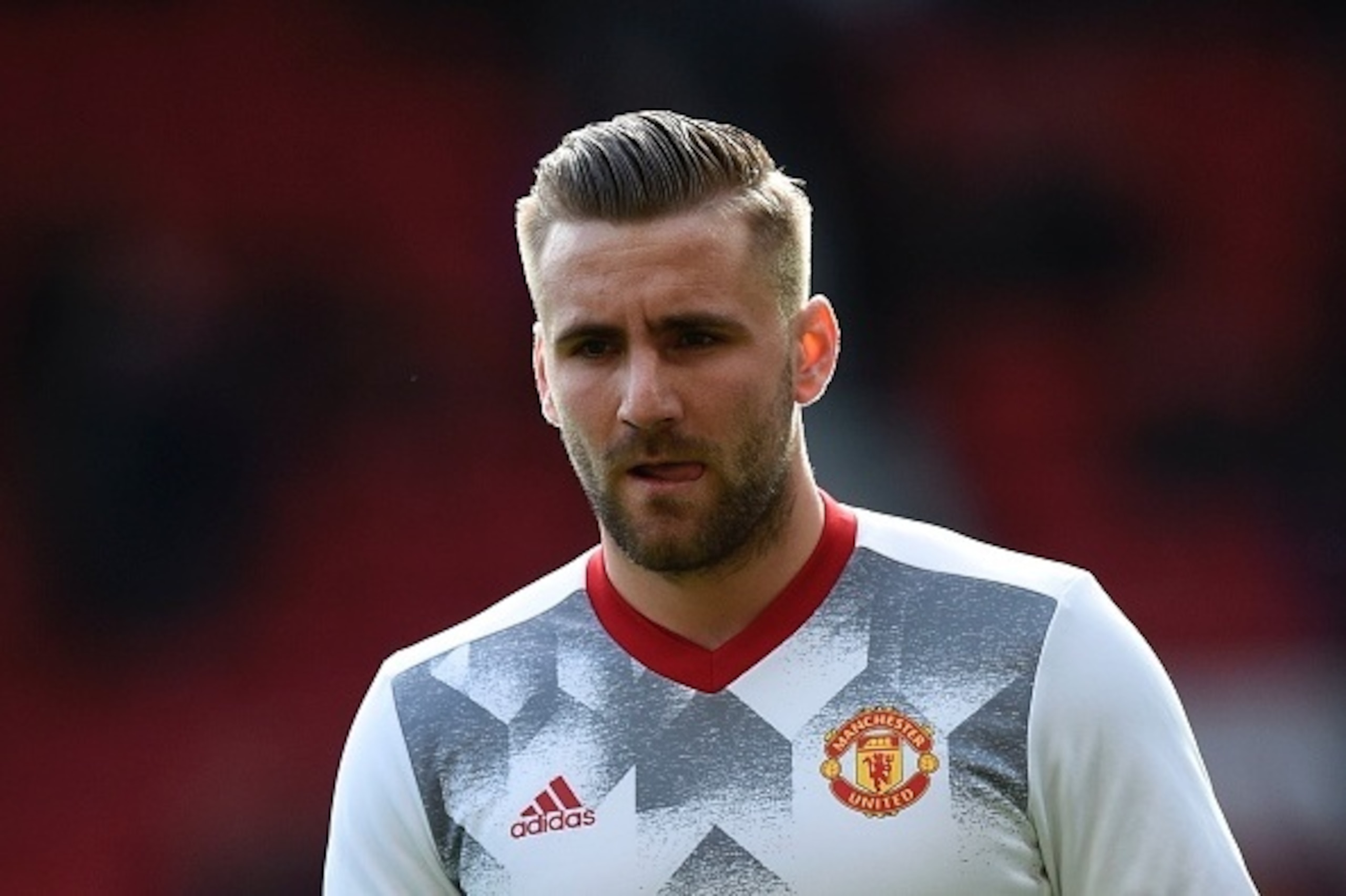 Manchester United's English defender Luke Shaw warms up before the English Premier League football match between Manchester United and Bournemouth at Old Trafford in Manchester, north west England, on March 4, 2017. / AFP PHOTO / Oli SCARFF / RESTRICTED T
