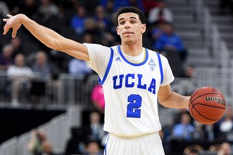 LAS VEGAS, NV - MARCH 09:  Lonzo Ball #2 of the UCLA Bruins sets up a play against the USC Trojans during a quarterfinal game of the Pac-12 Basketball Tournament at T-Mobile Arena on March 9, 2017 in Las Vegas, Nevada. UCLA won 76-74.  (Photo by Ethan Mil