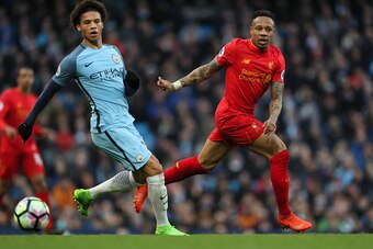 MANCHESTER, ENGLAND - MARCH 19: Nathaniel Clyne of Liverpool competes with Leroy Sane of Manchester City during the Premier League match between Manchester City and Liverpool at Etihad Stadium on March 19, 2017 in Manchester, England.  (Photo by Matthew A