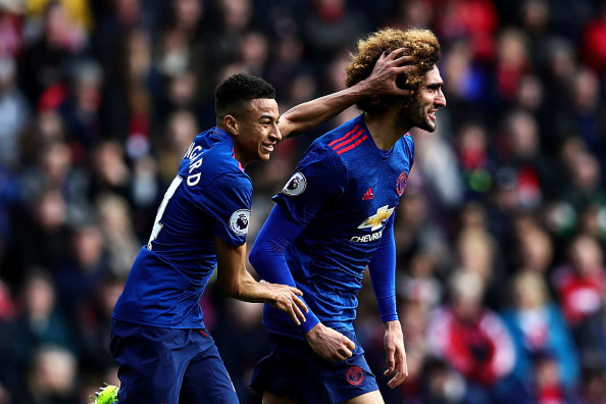 MIDDLESBROUGH, ENGLAND - MARCH 19: Marouane Fellaini of Manchester United celebrates scoring the opening goal with team-mate Jesse Lingard during the Premier League match between Middlesbrough and Manchester United at Riverside Stadium on March 19, 2017 i