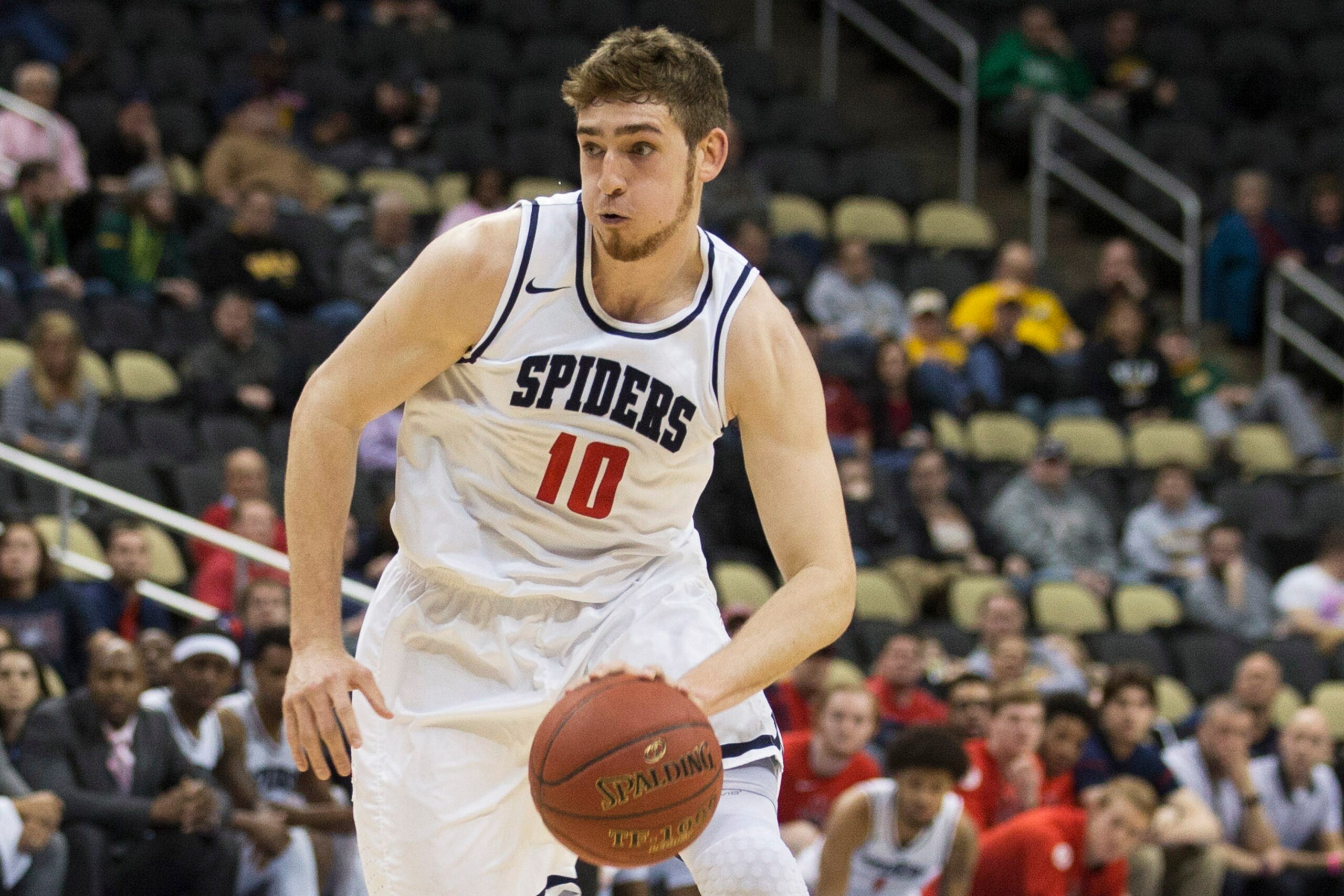 PITTSBURGH, PA - MARCH 10: T.J. Cline #10 of the Richmond Spiders drives to the basket against the George Washington Colonials in the Quarterfinals of the men's Atlantic 10 tournament at the PPG Paints Arena on March 10, 2017 in Pittsburgh, Pennsylvania.