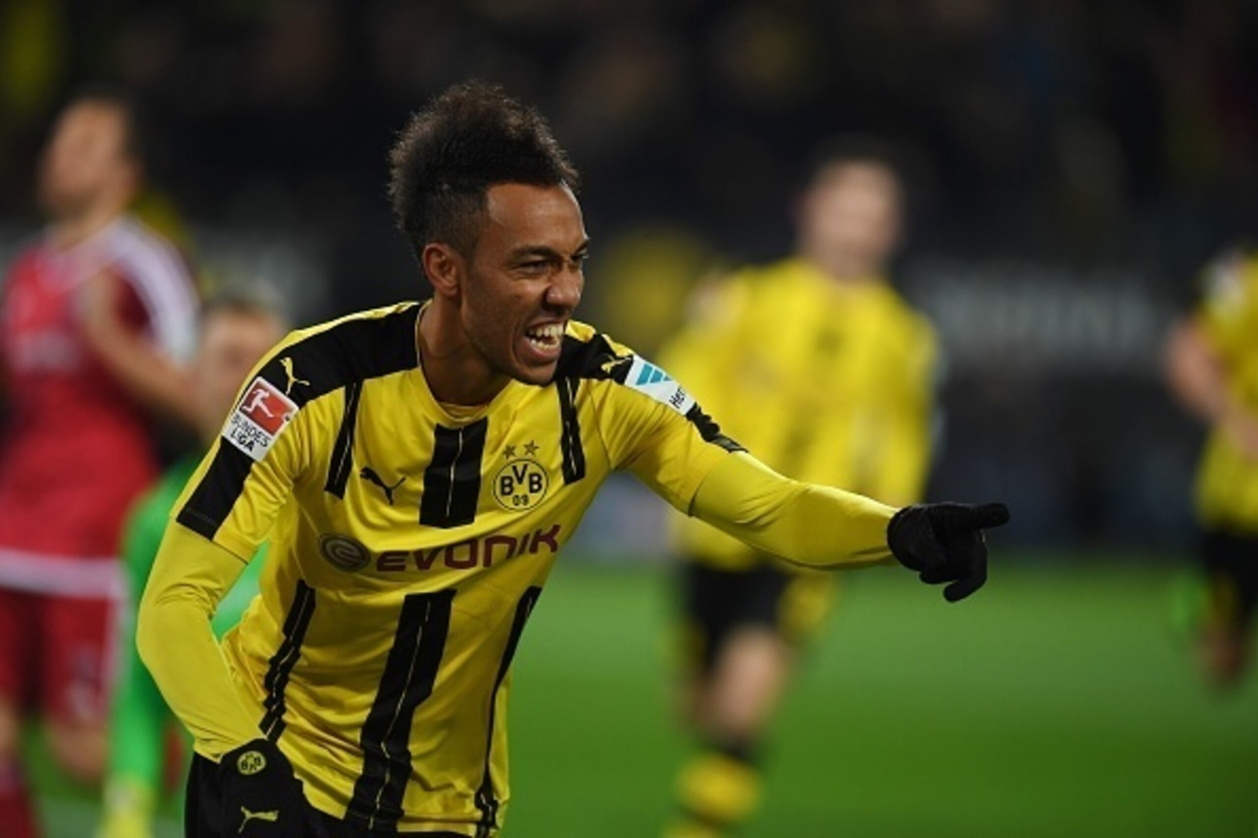 Dortmund's Gabonese forward Pierre-Emerick Aubameyang celebrates scoring the opening goal with his teammates during the German First division Bundesliga football match BVB Borussia Dortmund vs FC Ingolstadt in Dortmund, western Germany on March 17, 2017. 